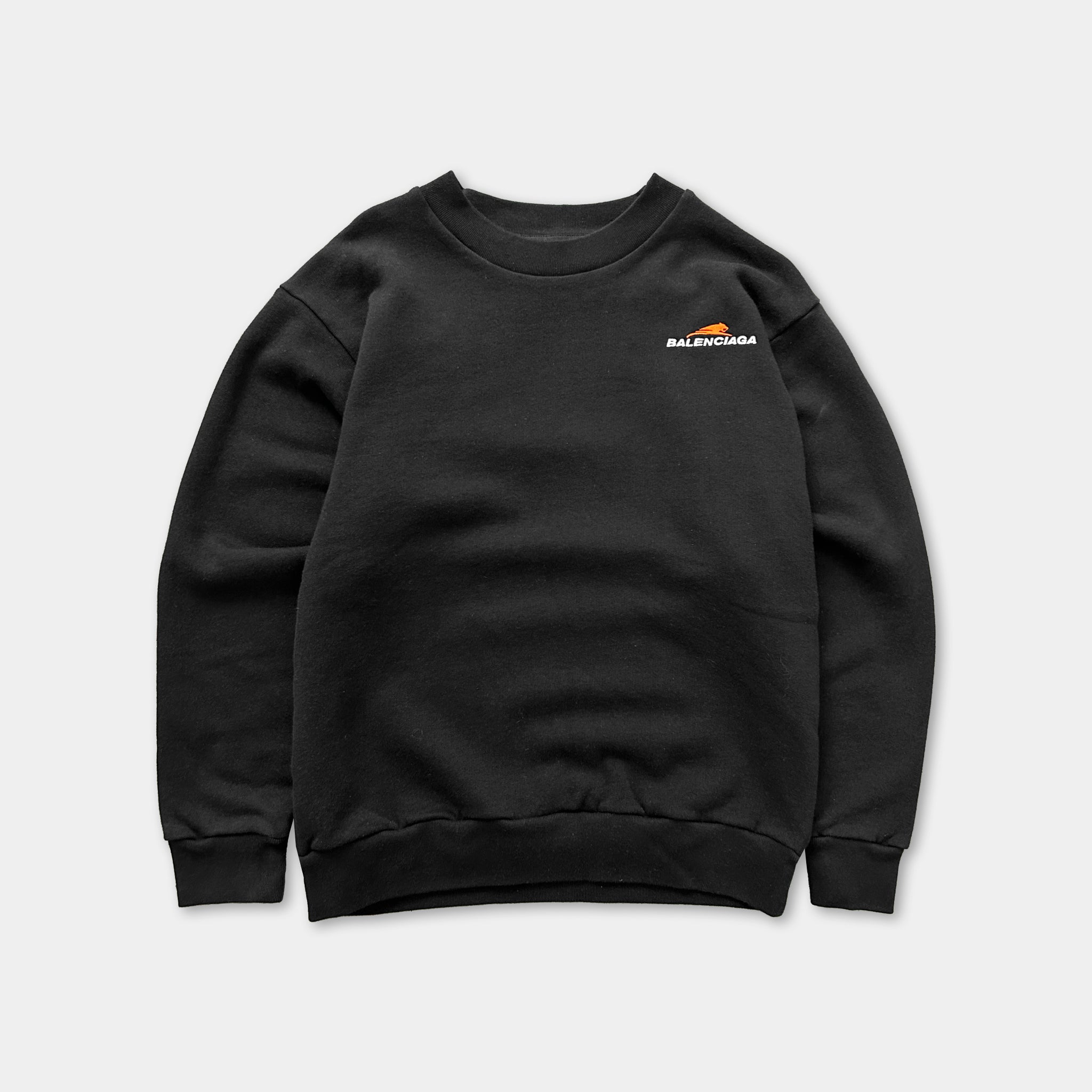 A black sweatshirt with a logo on the left side.