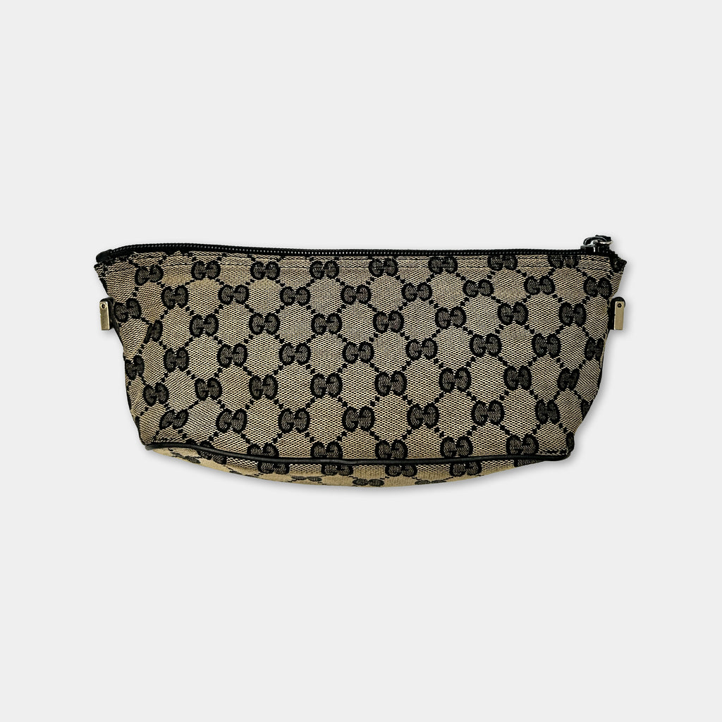 A black and white patterned handbag with a distinctive Gucci-inspired design.