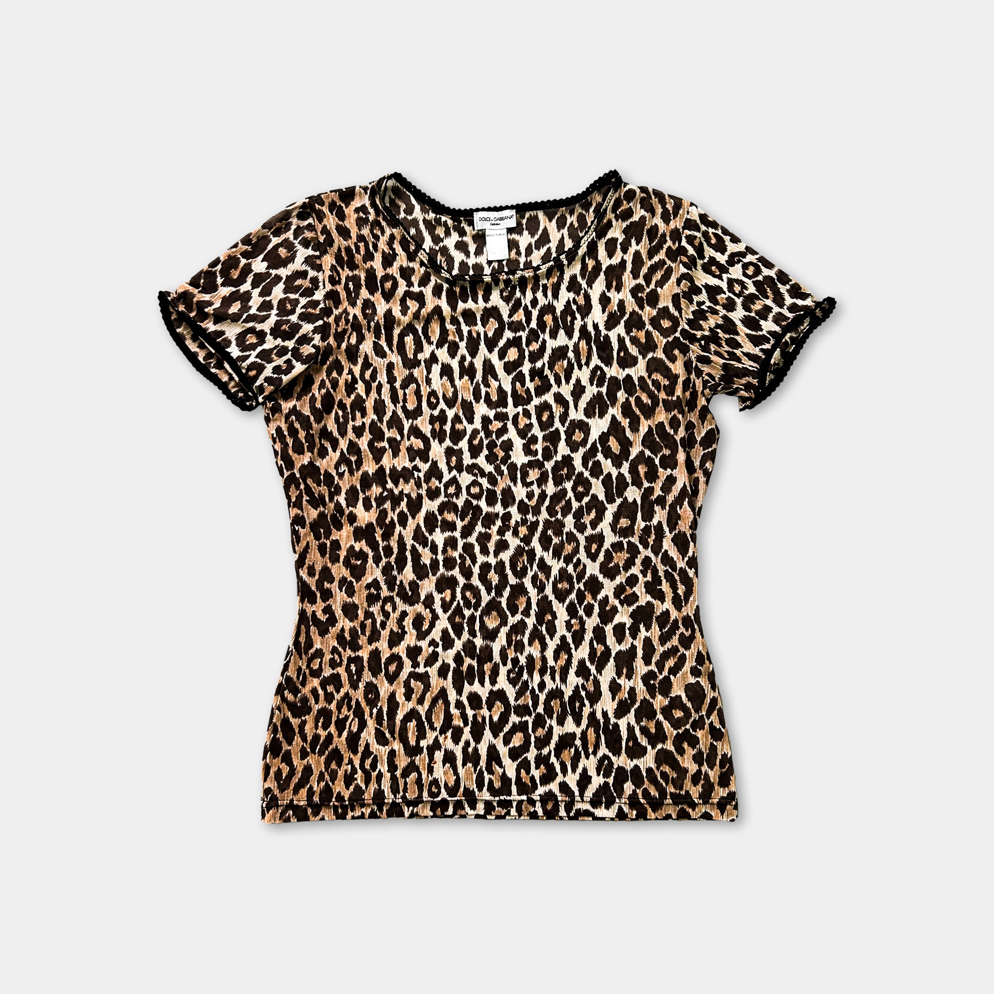 A leopard print top is displayed against a white background.