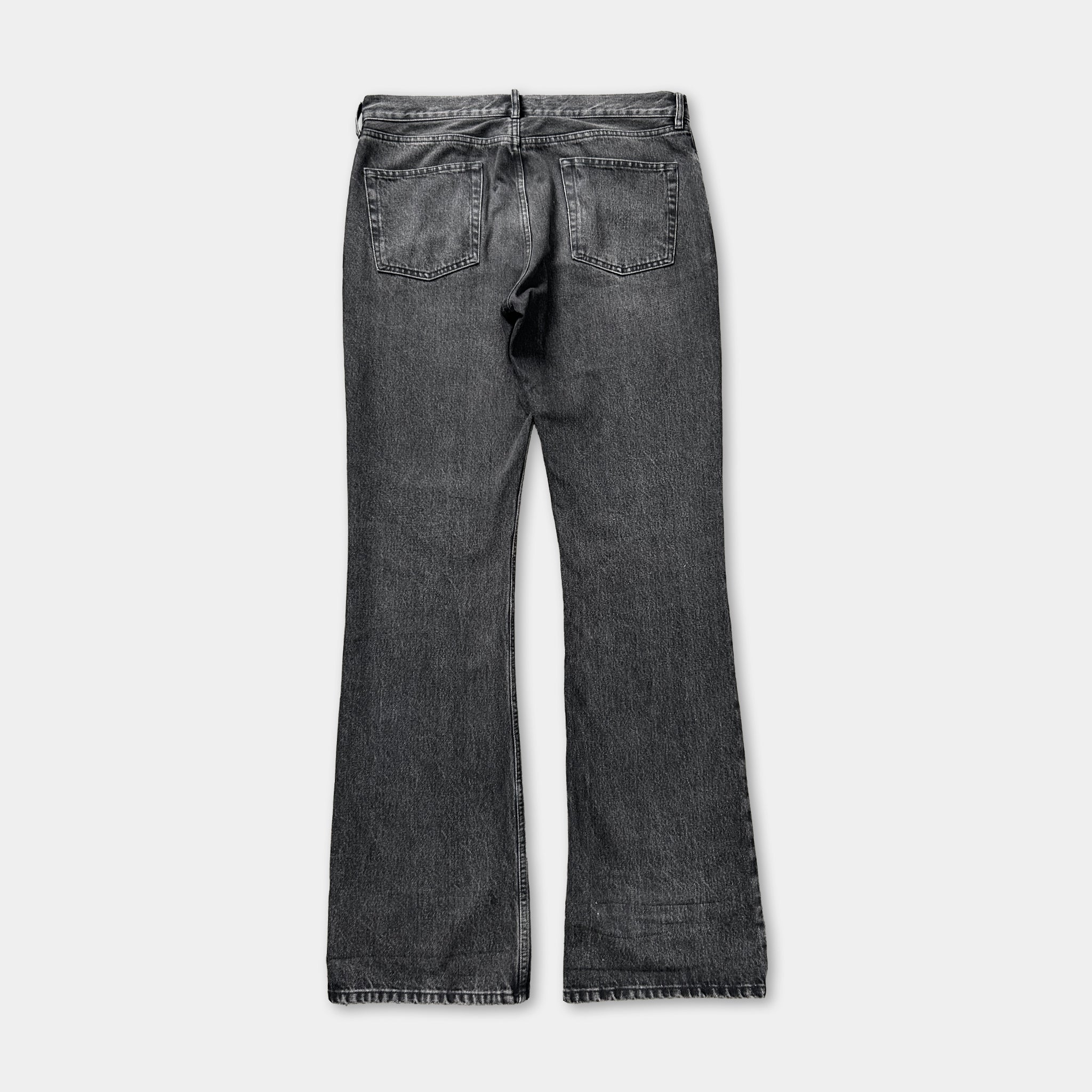 A pair of black jeans with a high-waisted design.