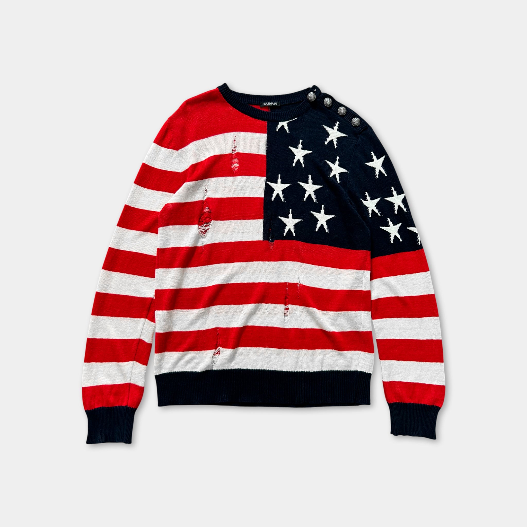 A red and white striped sweater with an American flag design on the front.