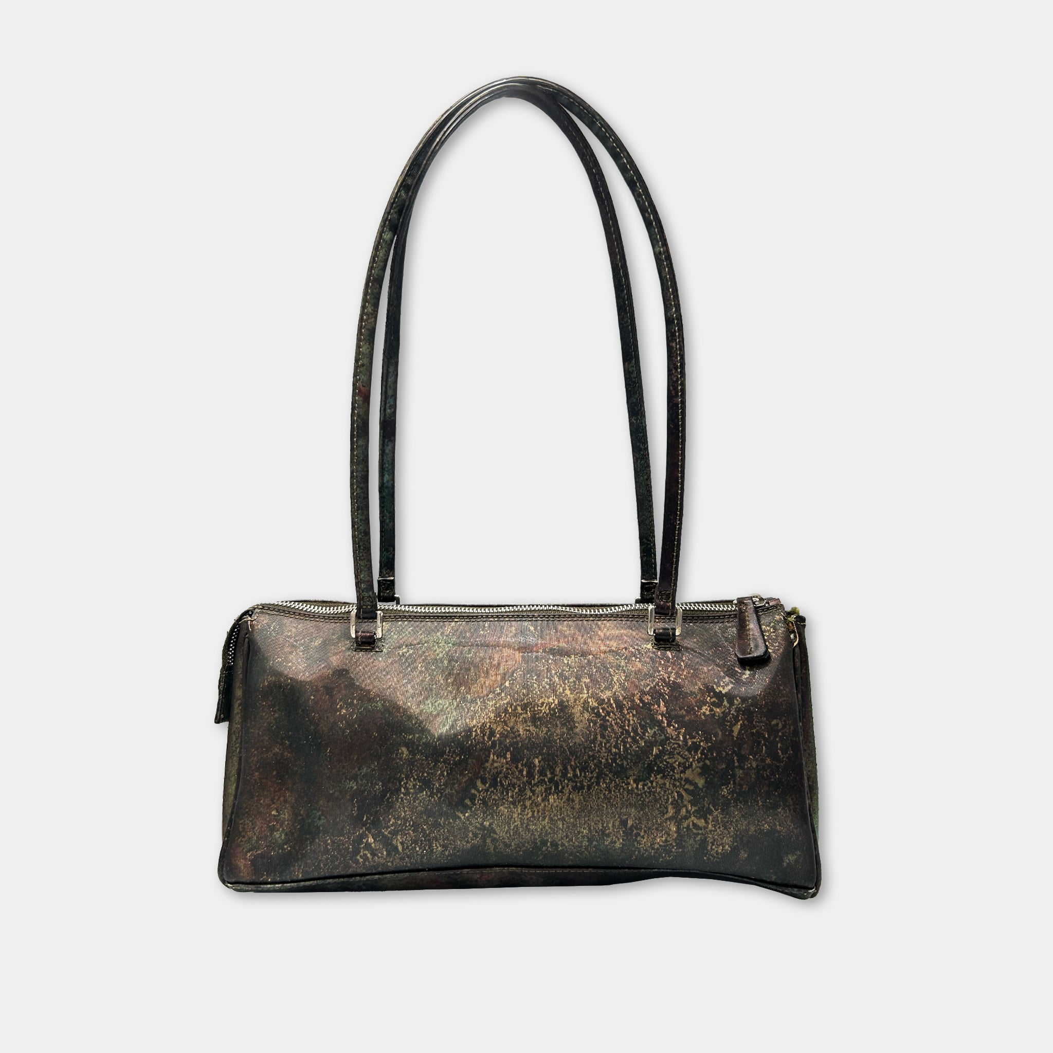 A black leather handbag with a floral pattern on the front.