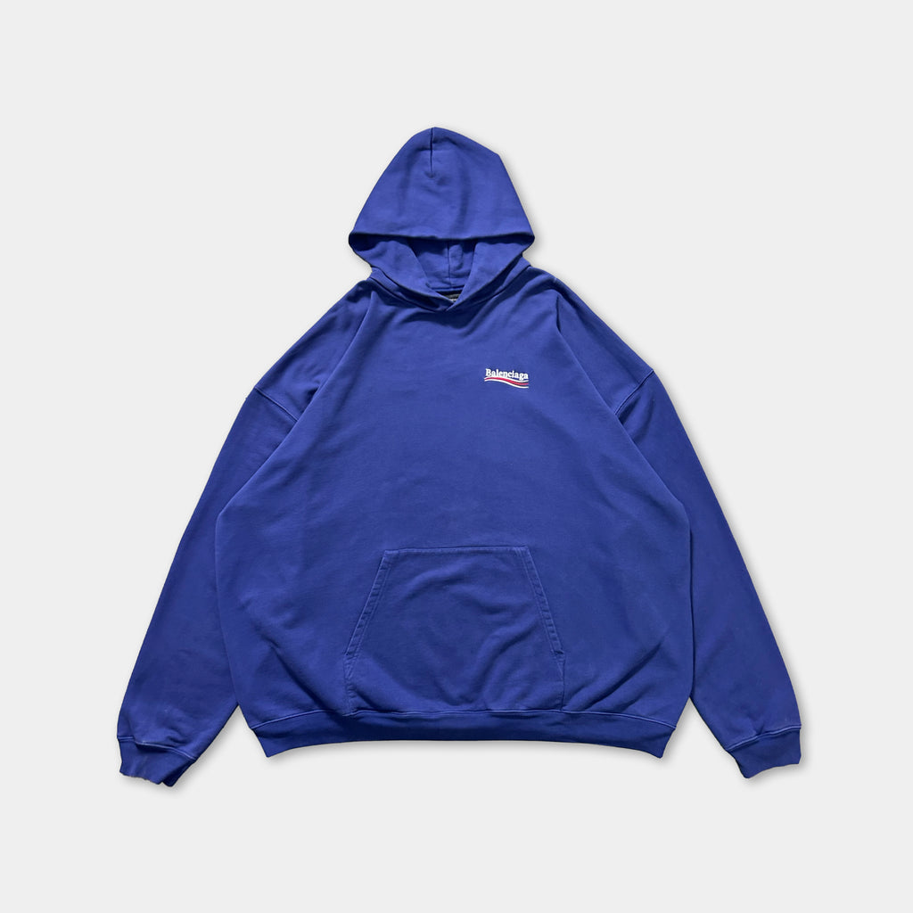 A large navy blue hooded sweatshirt with a small logo on the front.