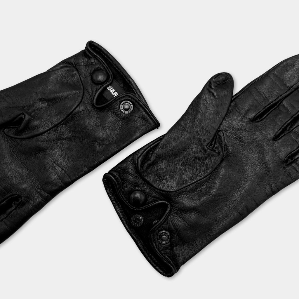 A pair of black leather gloves with buttons and a logo on the left glove.