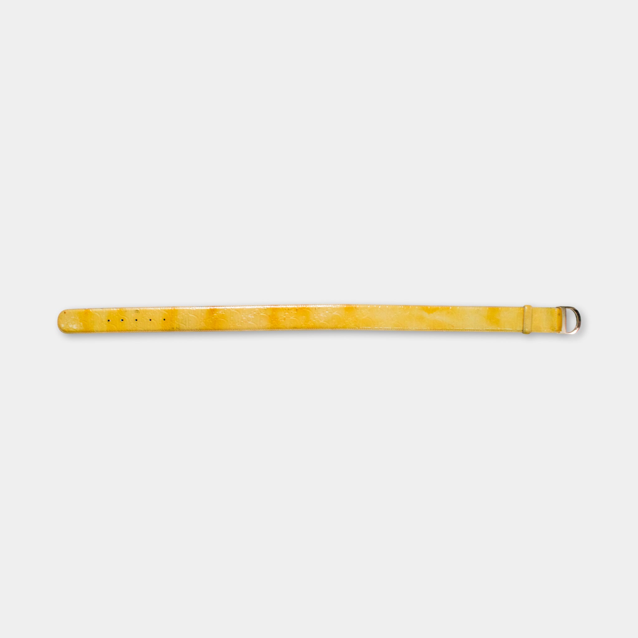 A yellow belt with a metal buckle is shown against a plain white background.