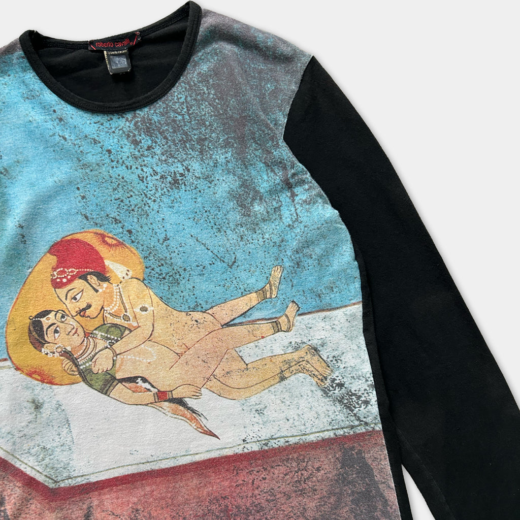 a colorful printed shirt with a graphic design depicting a couple embracing.