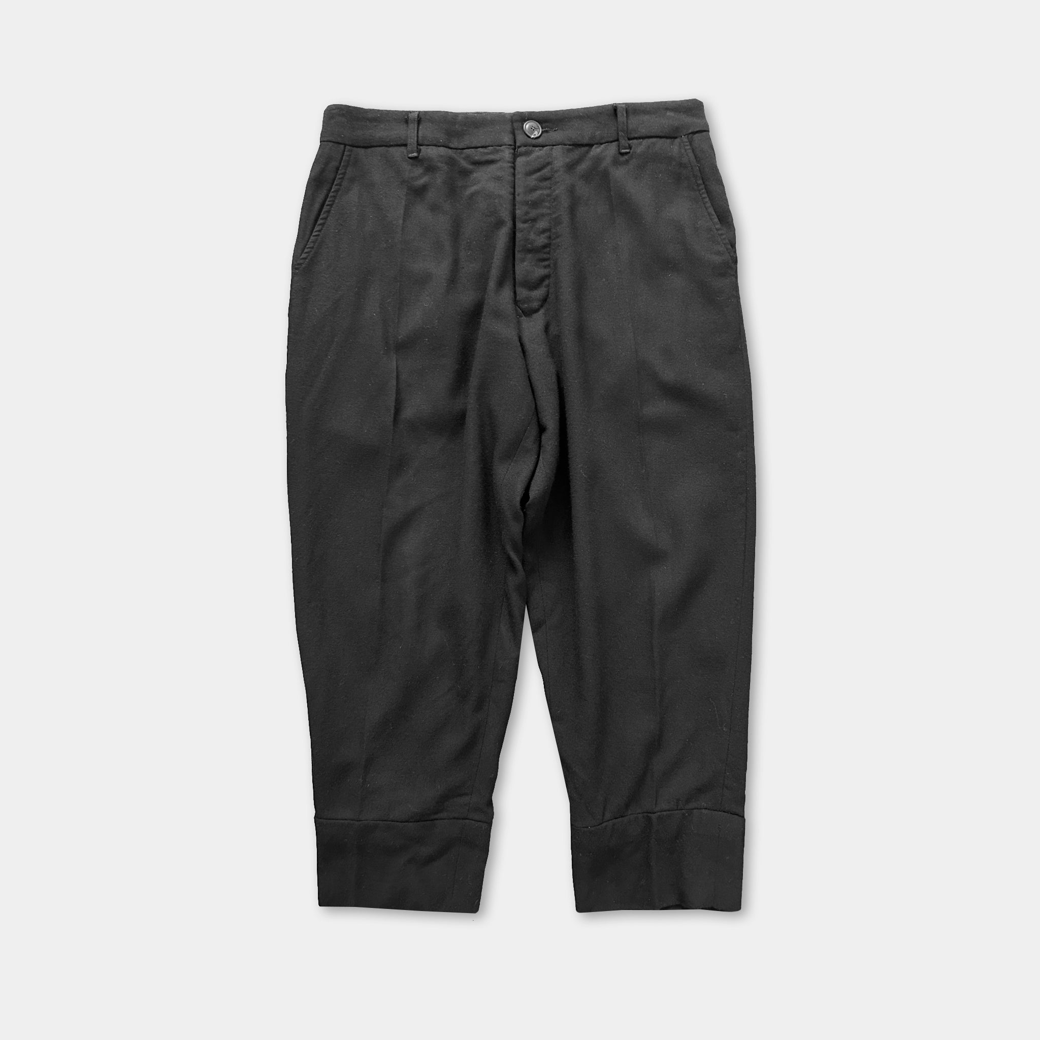 A pair of black trousers with a button waistband and pockets.