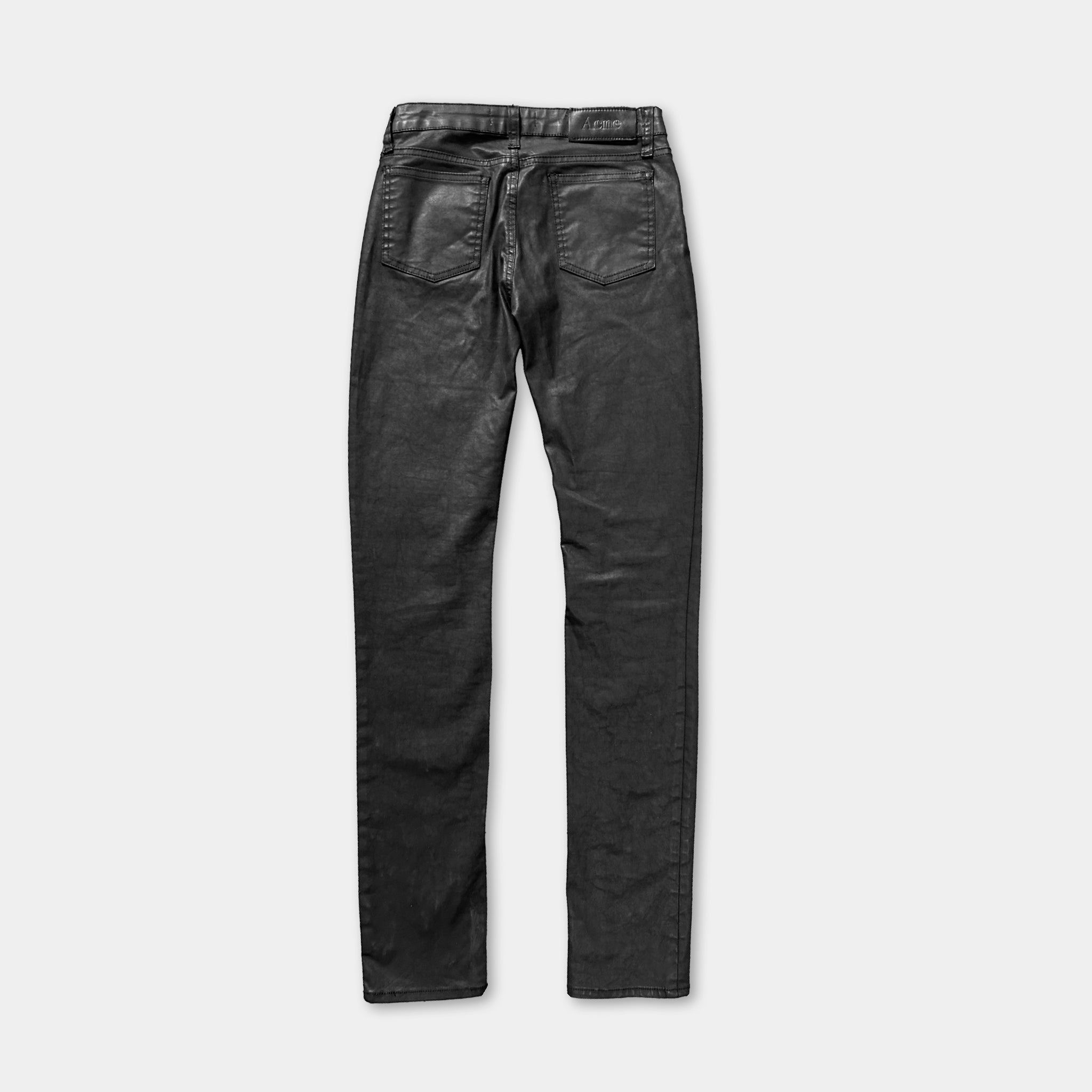A pair of black skinny jeans with a high-waisted design.