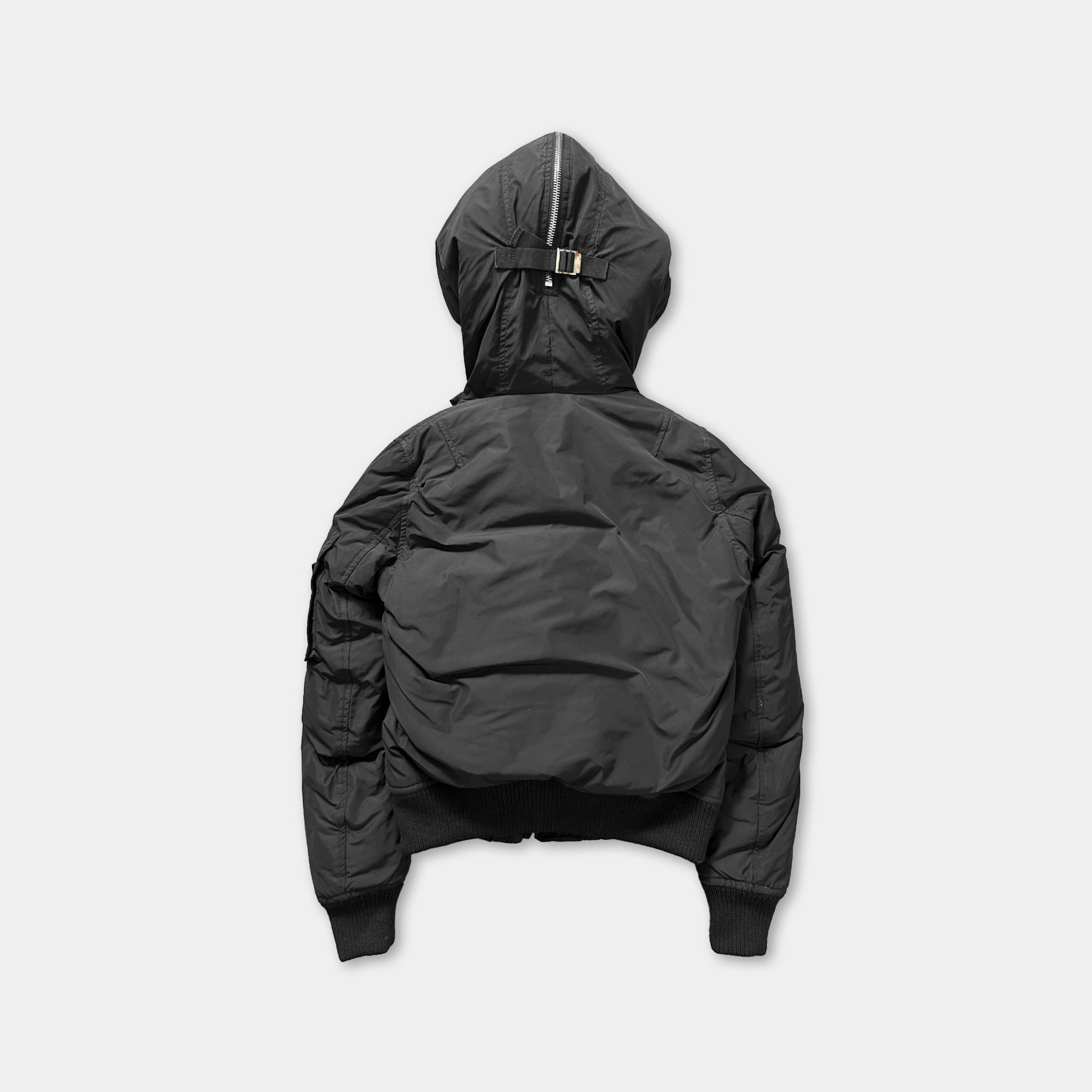 A black hooded jacket with a zipper and hood is shown against a plain white background.