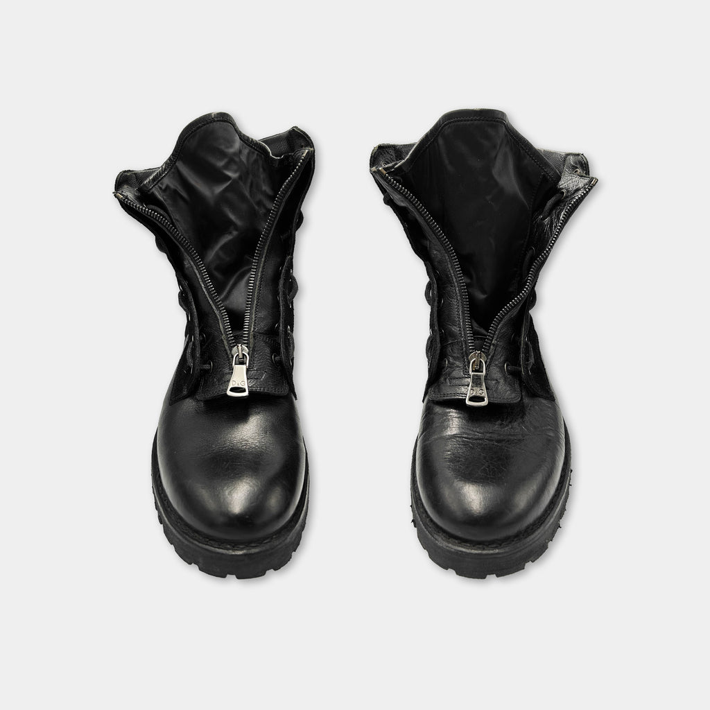 A pair of black leather boots with zippers on the sides.