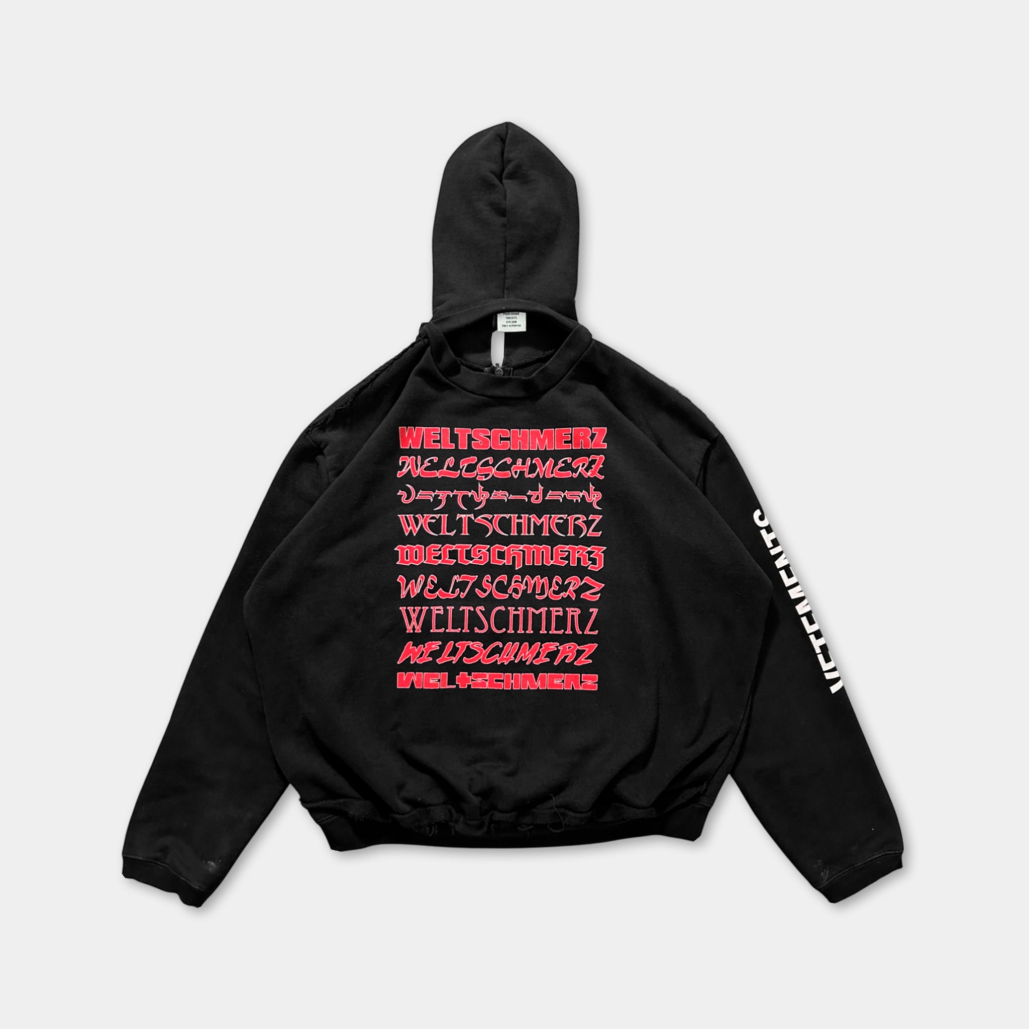 A black hoodie with red text on the back.