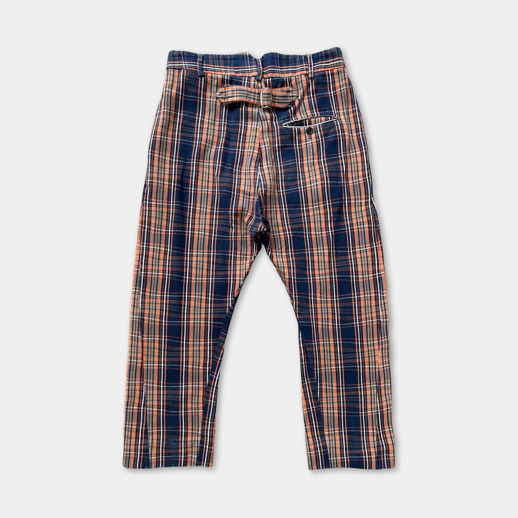 A pair of plaid pants with a belt and pocket.