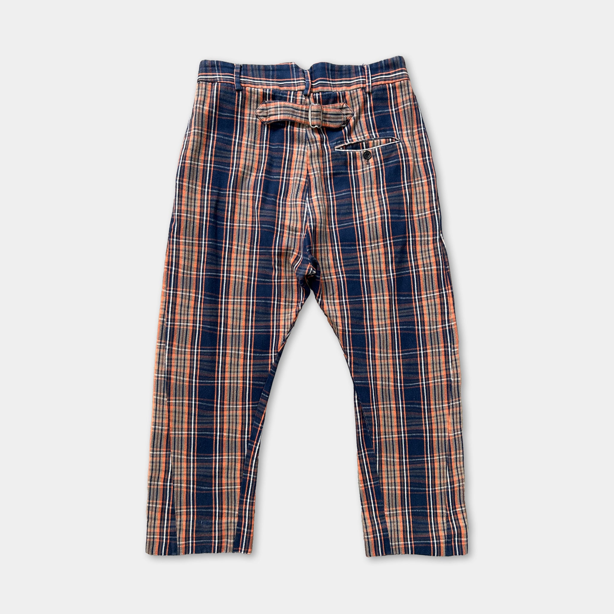 A pair of plaid pants with a belt and pocket.