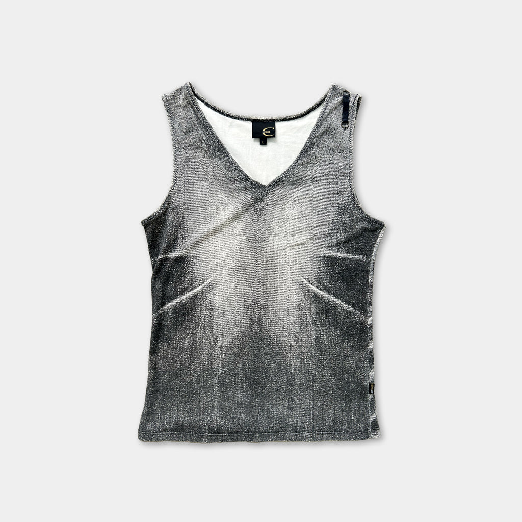 a gray tank top with a distinctive black and white pattern.