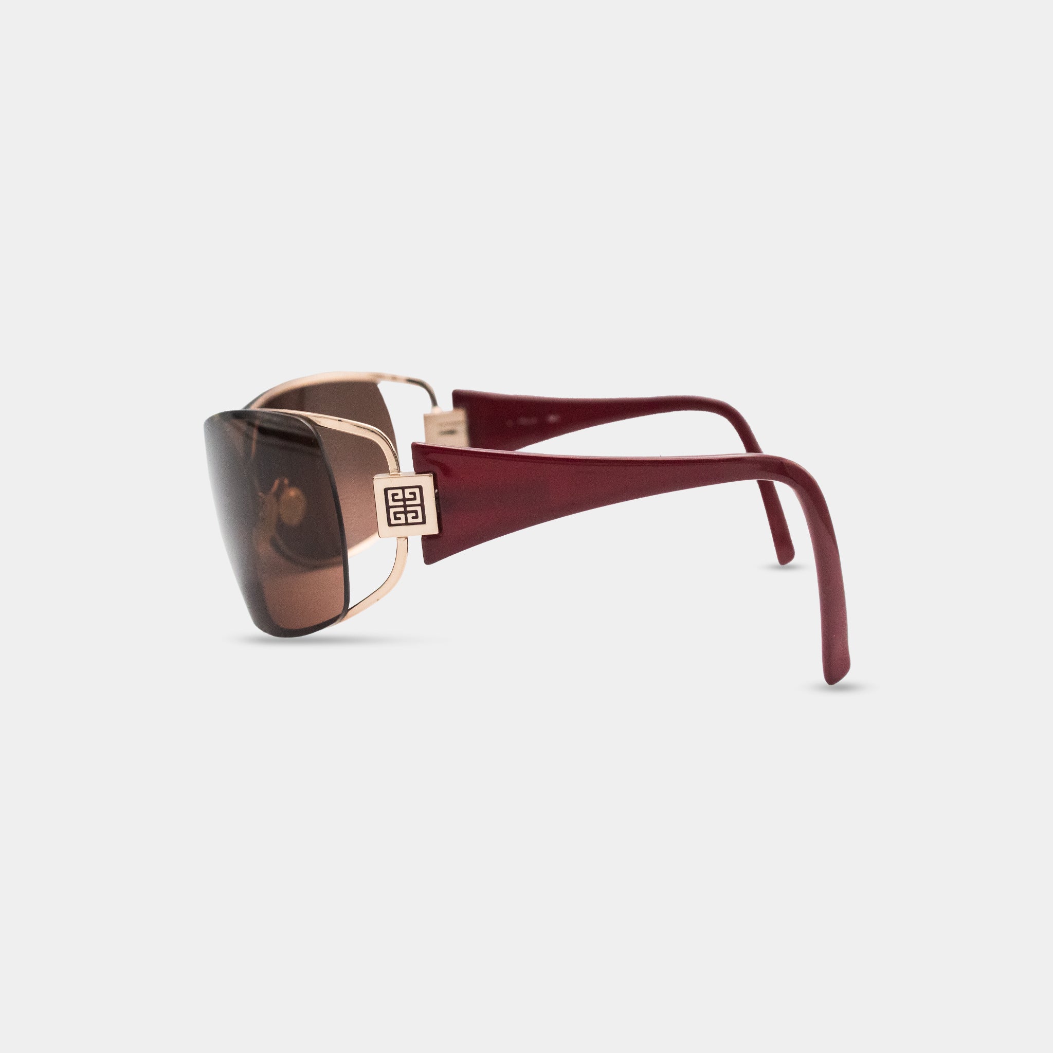A pair of stylish sunglasses with a maroon frame and brown lenses.