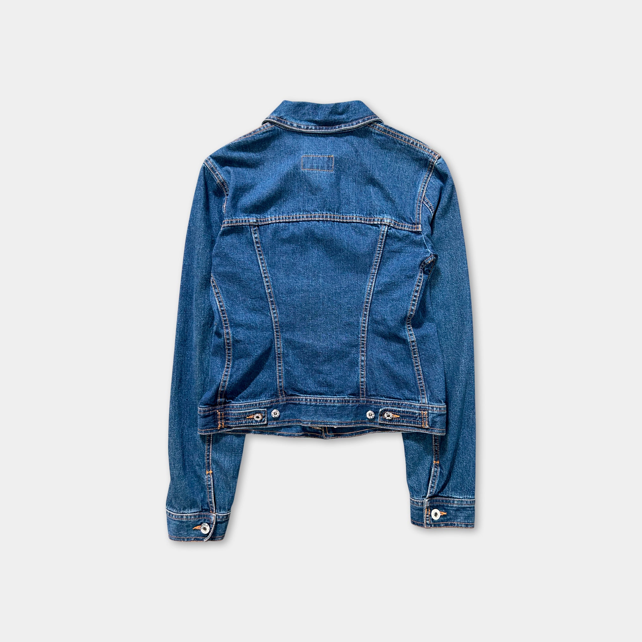 A denim jacket with a high collar and long sleeves is shown against a plain background.