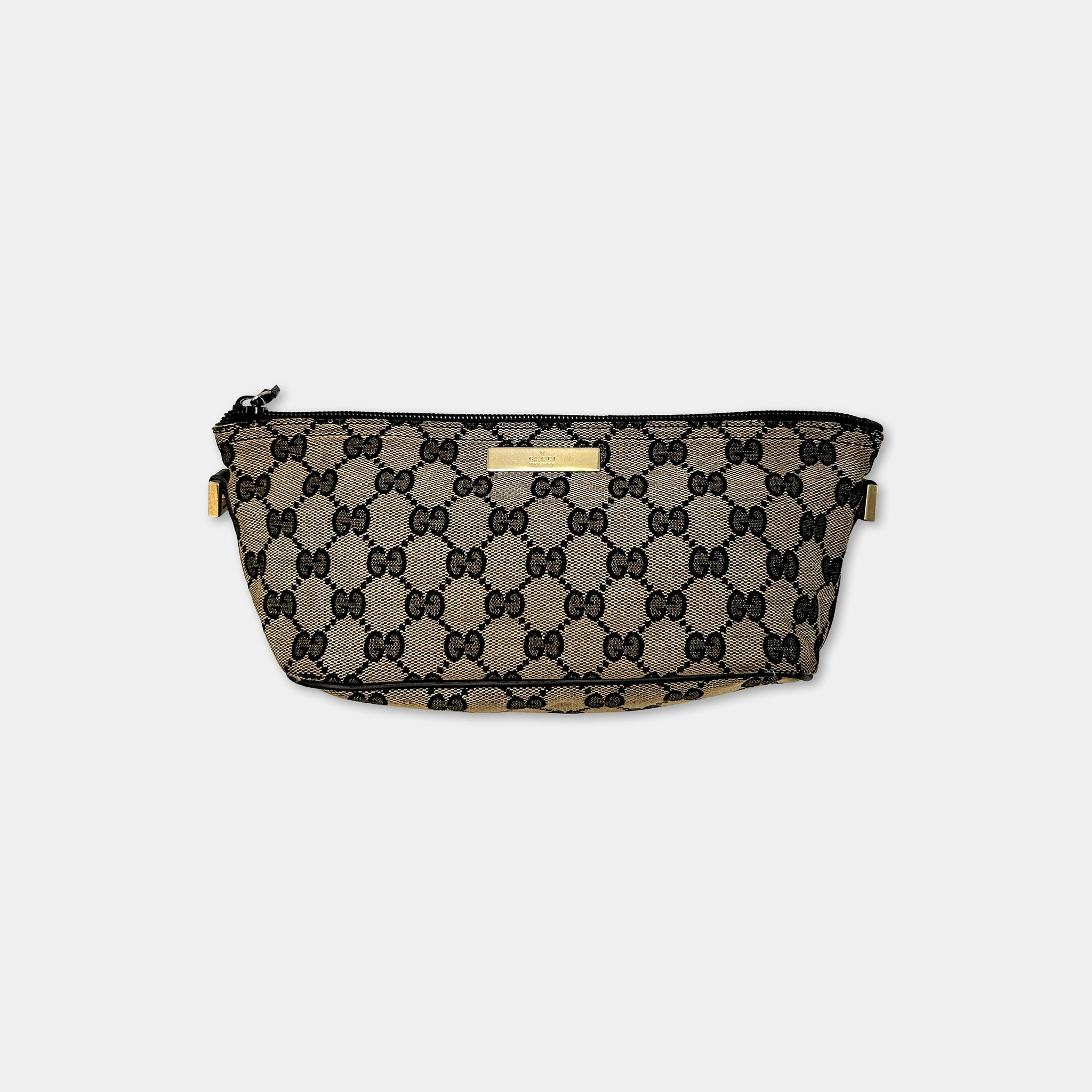 A black and gold Gucci-patterned bag with a zipper closure and gold hardware.