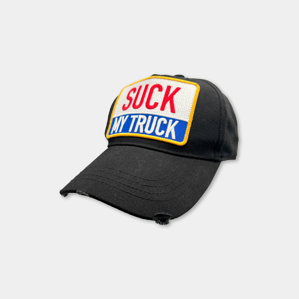 A black baseball cap with a patch on the front that says "SUCK MY TRUCK".