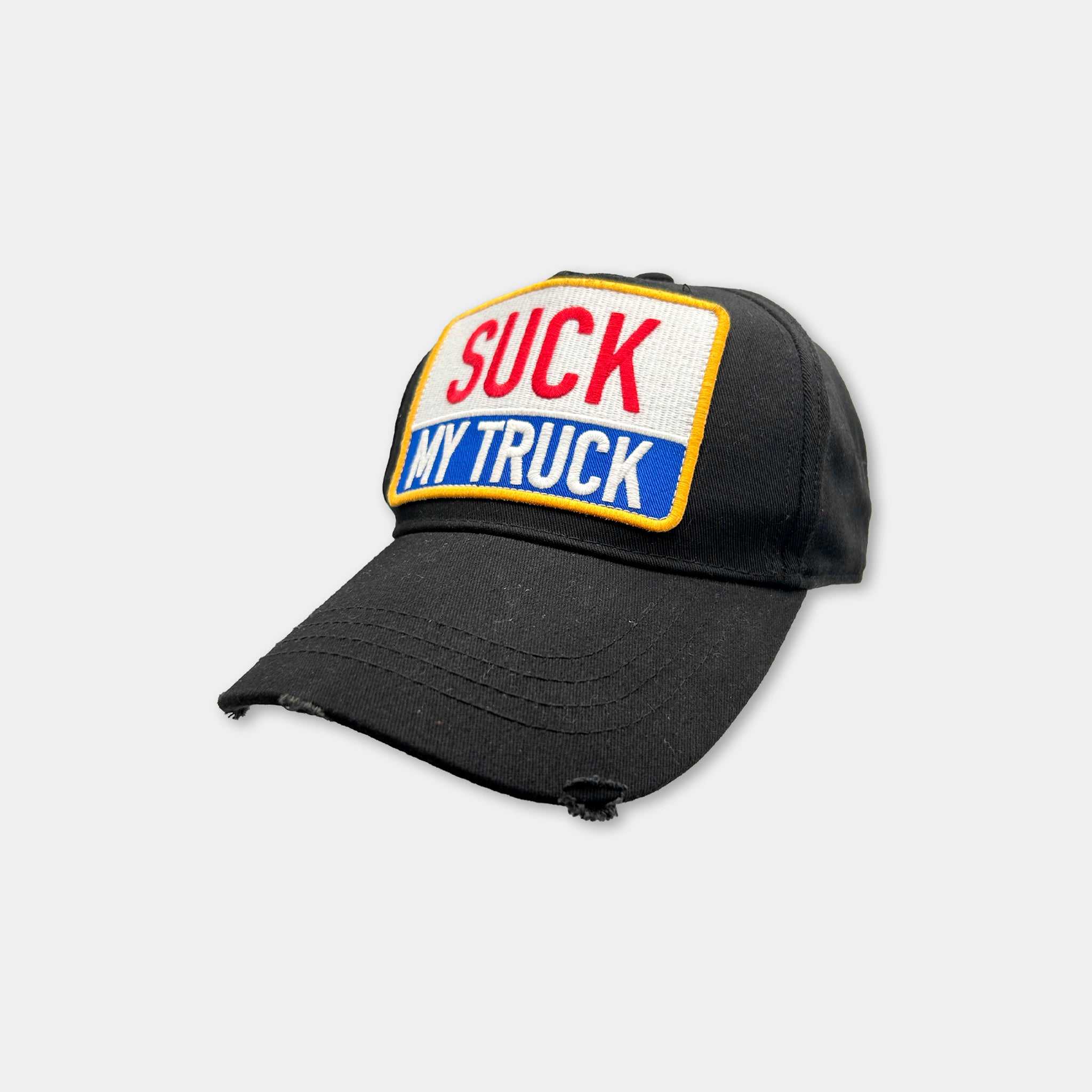 A black baseball cap with a patch on the front that says "SUCK MY TRUCK".
