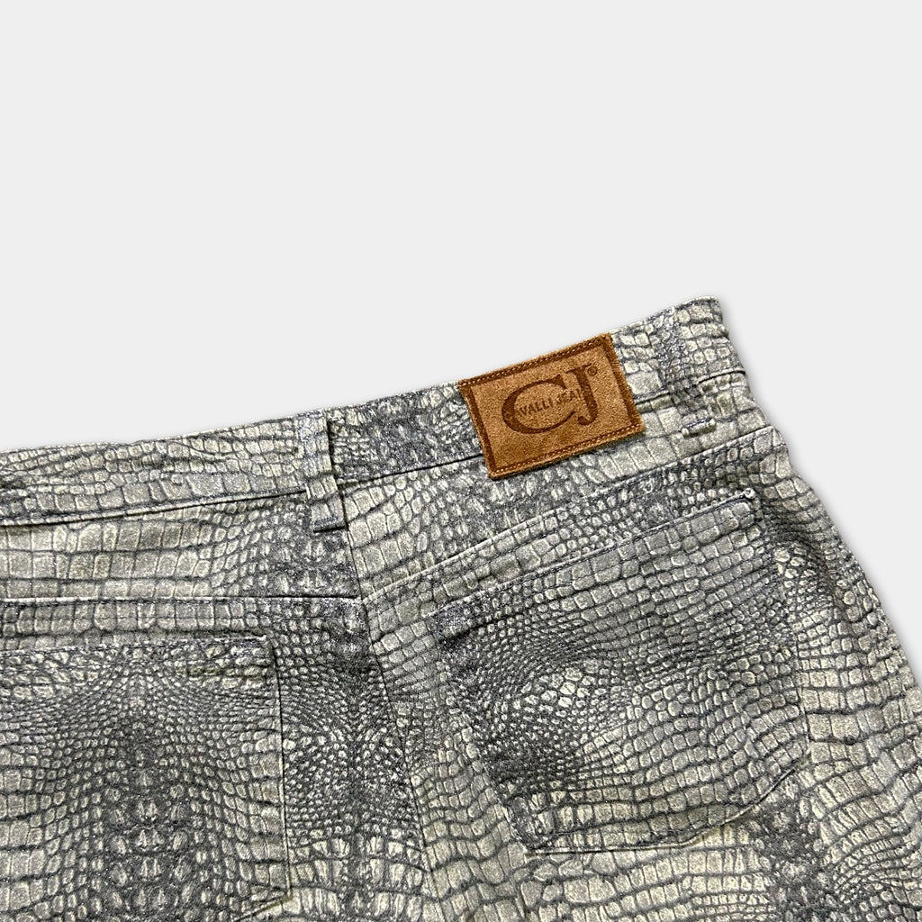 a pair of gray and white patterned jeans with a brown leather patch on the waistband.