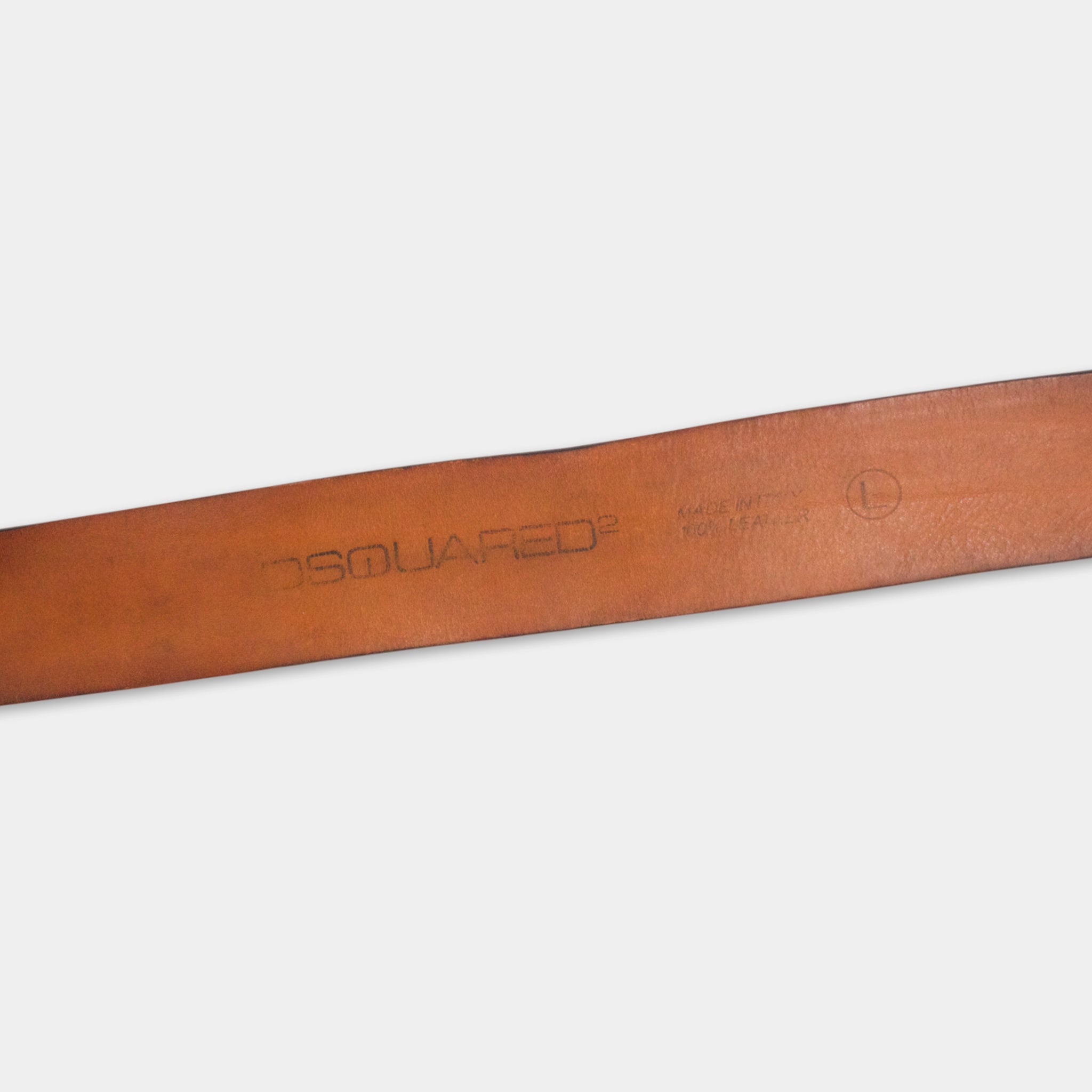 A close-up view of a brown leather belt with the brand name "DSOLIAR" printed on it.