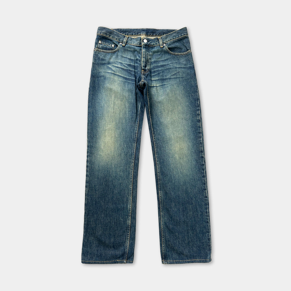 A pair of blue jeans with a faded, distressed appearance.