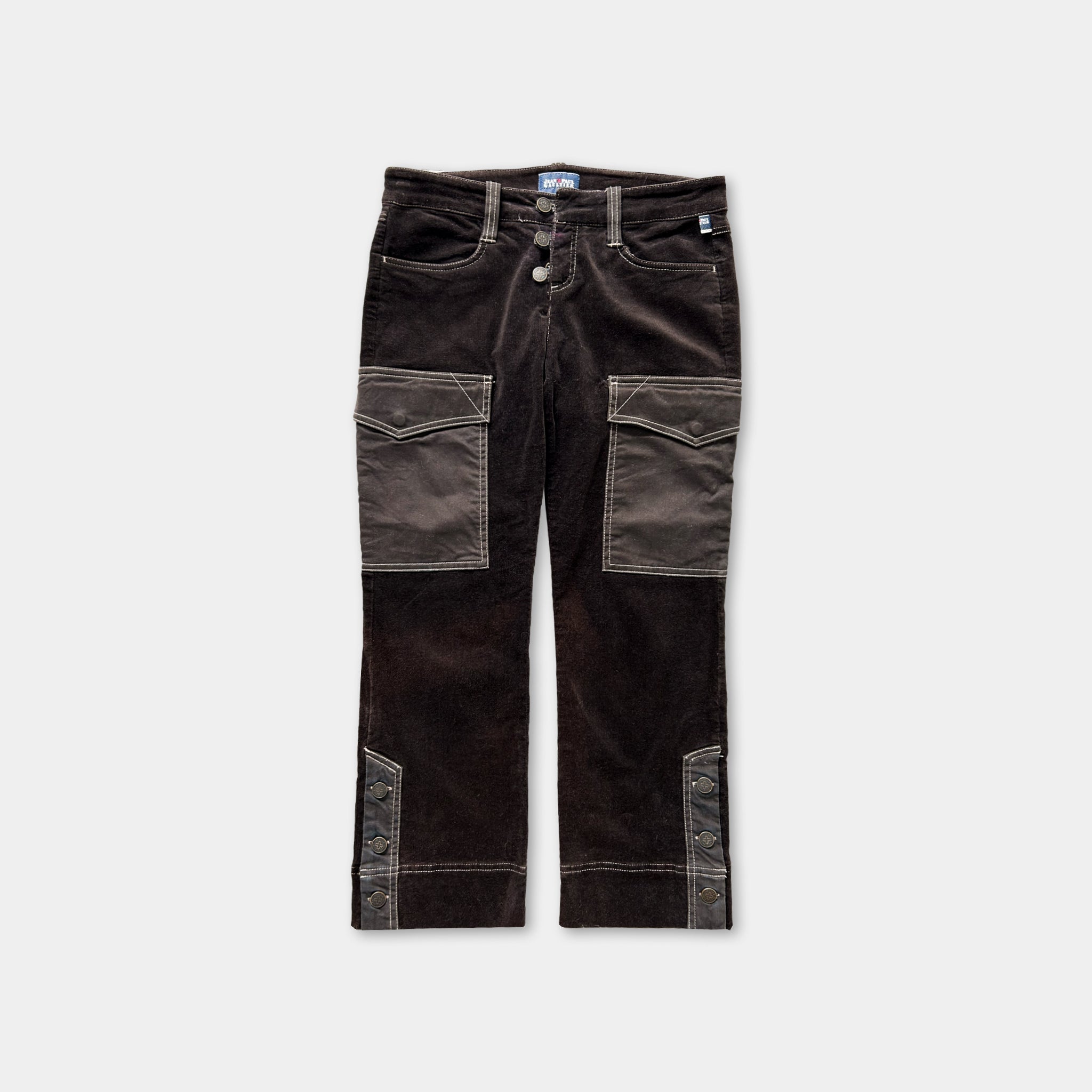A pair of dark brown, button-up jeans with pockets on the sides.