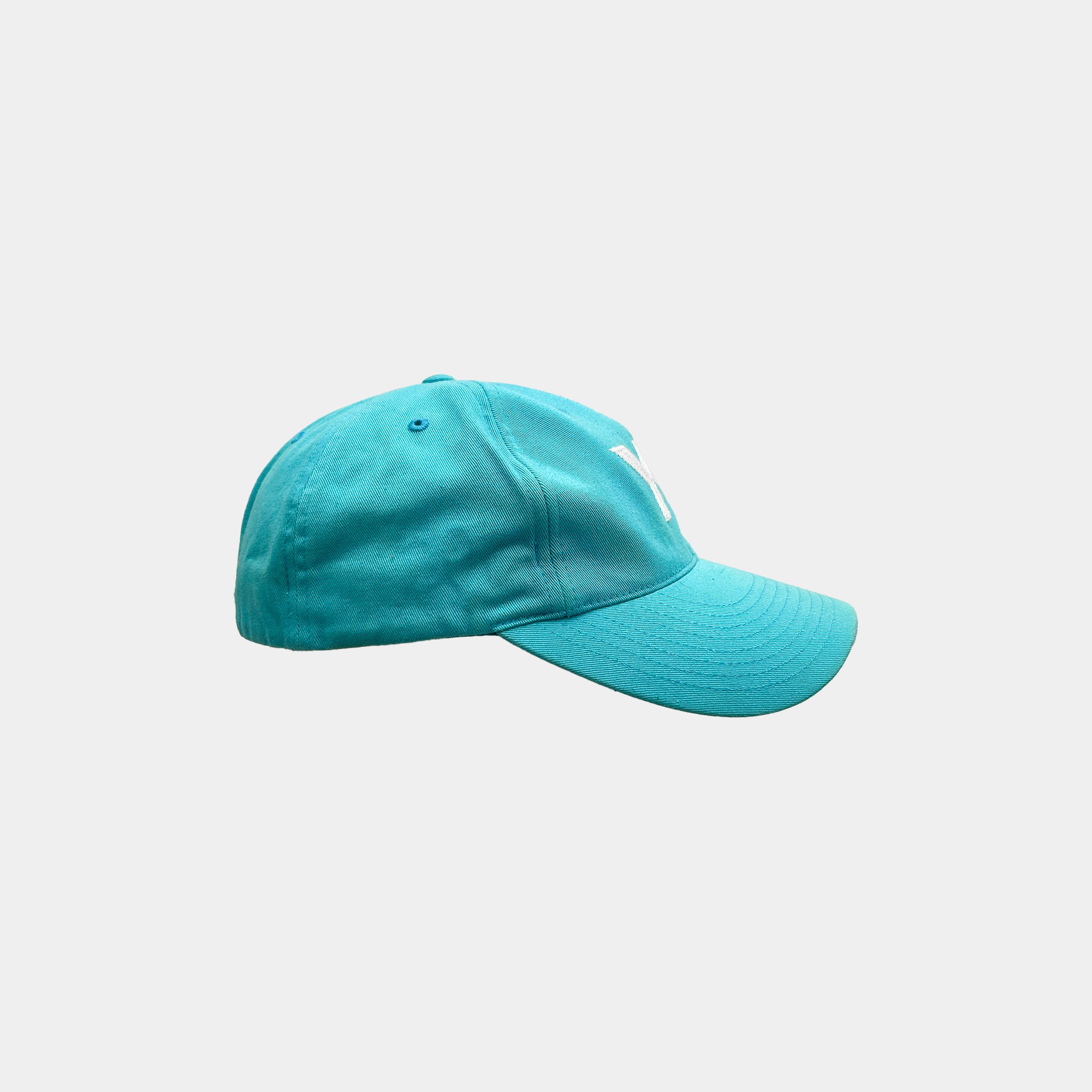 A turquoise baseball cap with a white logo on the front.