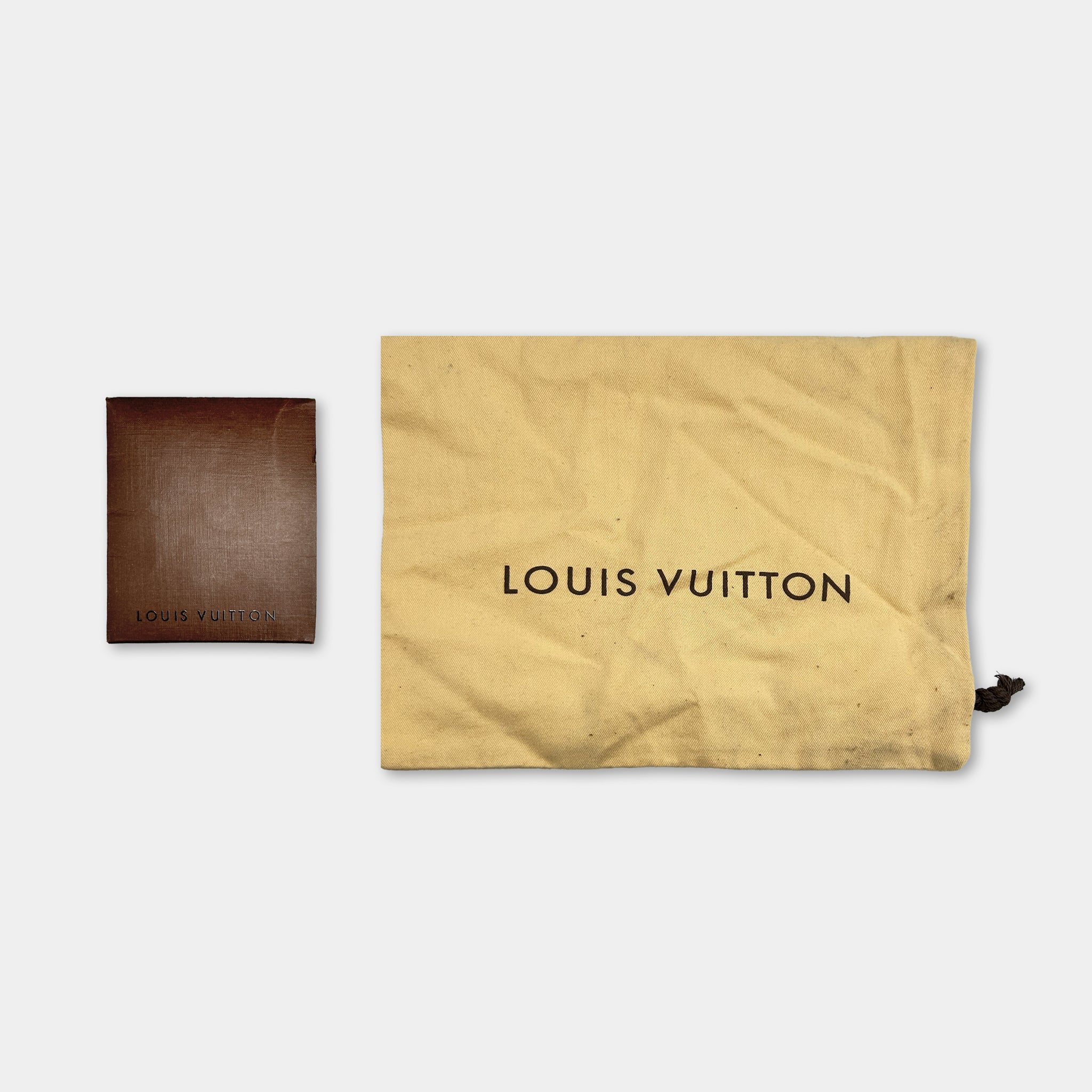 a brown wallet and a yellow bag with the text "LOUIS VUITTON" printed on them.