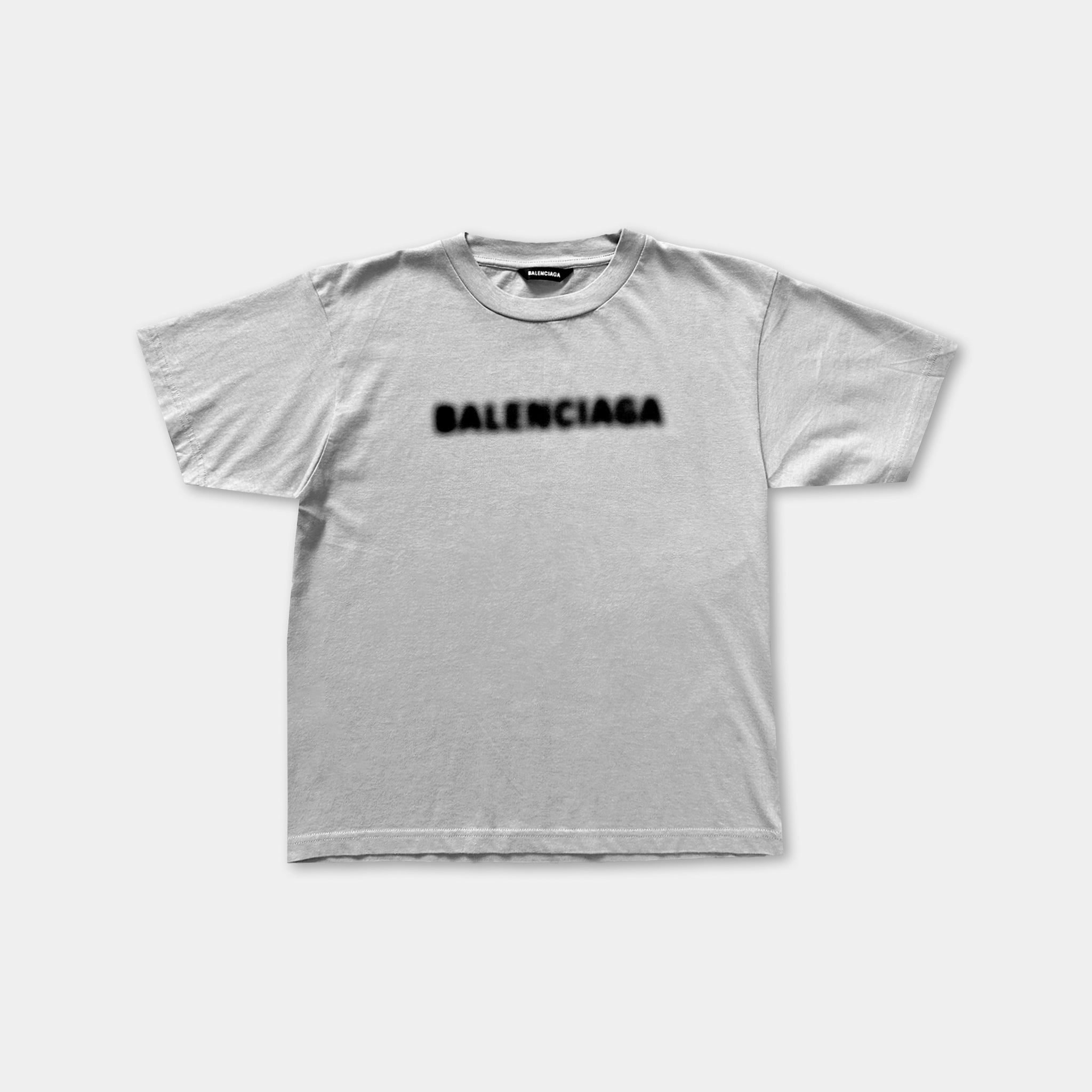 A plain white t-shirt with the word "BALENCIA" printed on it in a bold, black font.