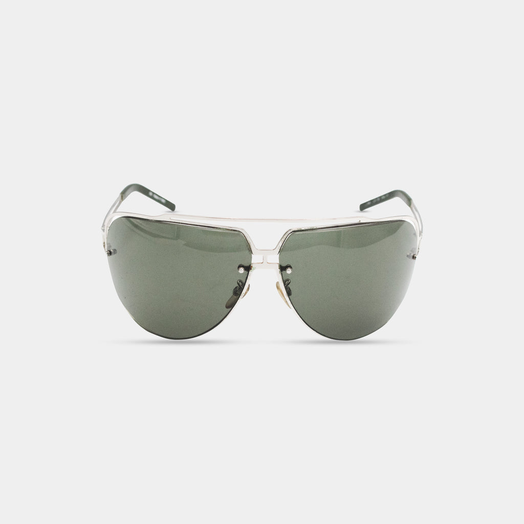 A pair of dark green rimmed sunglasses with a silver frame.