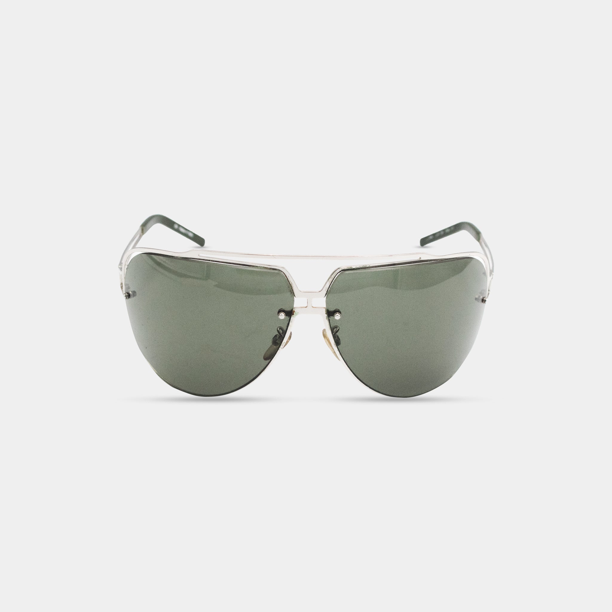 A pair of dark green rimmed sunglasses with a silver frame.