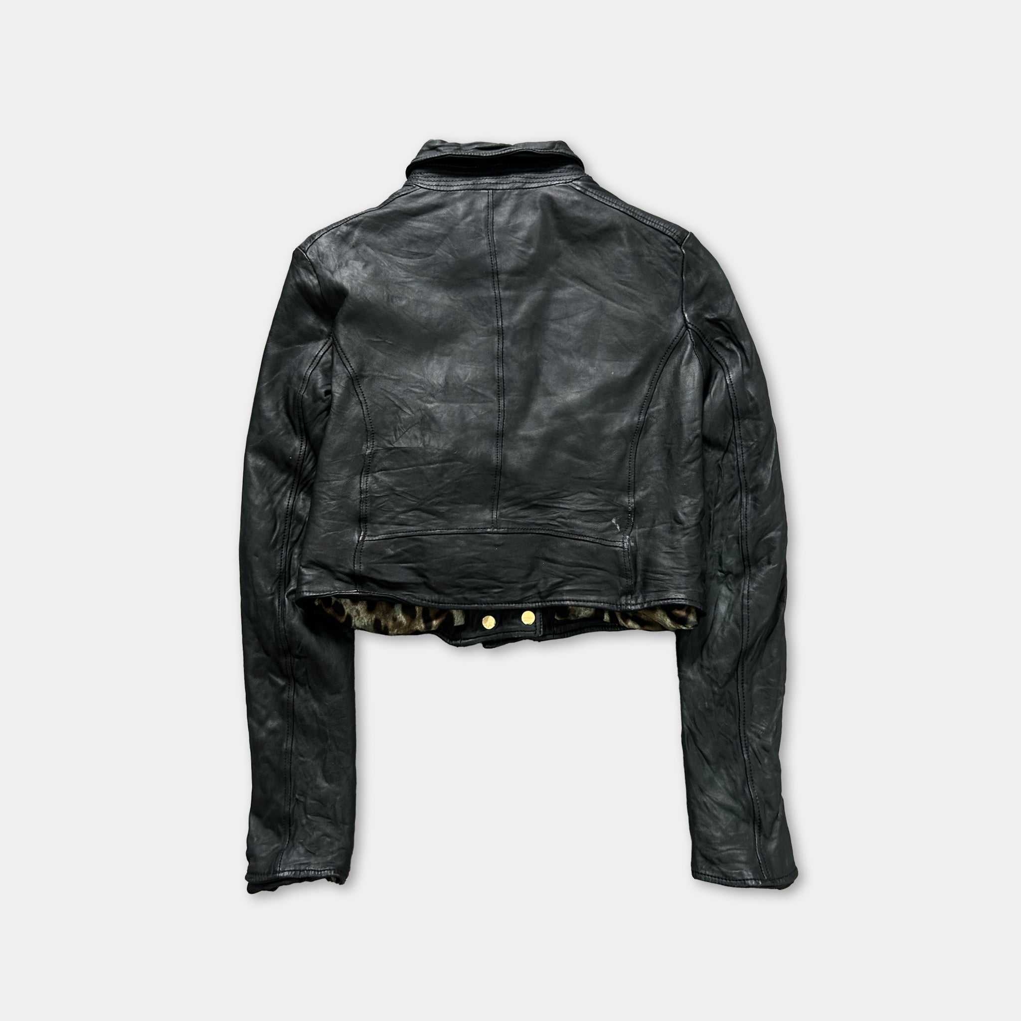 A black leather jacket with a collar and long sleeves, displayed against a plain background.