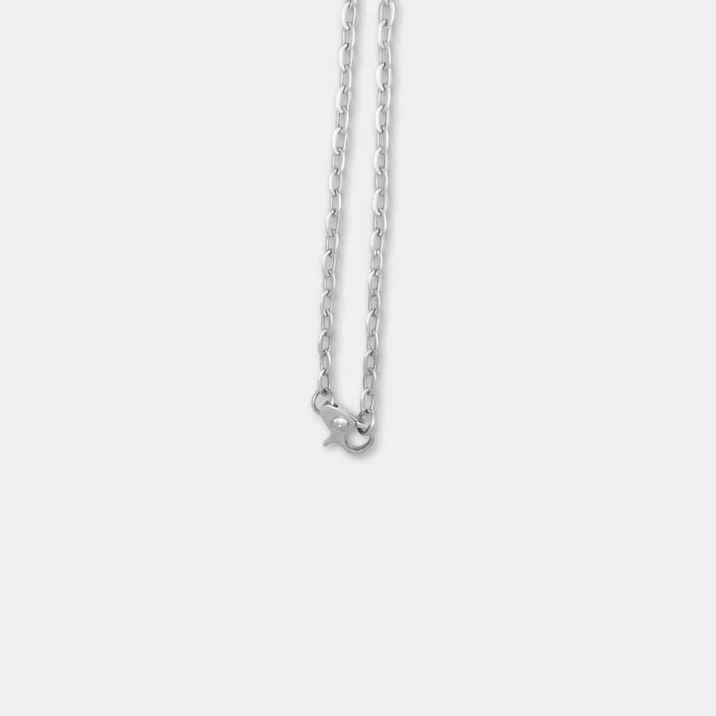 A silver necklace with a clasp is shown against a plain white background.