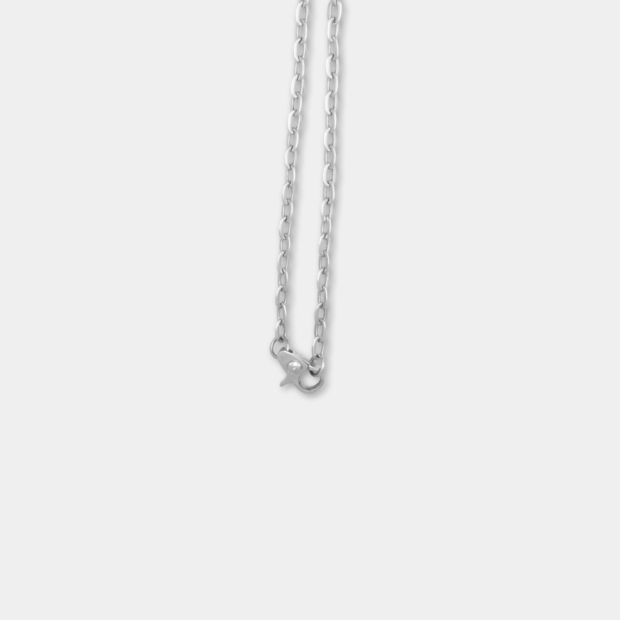 A silver necklace with a clasp is shown against a plain white background.