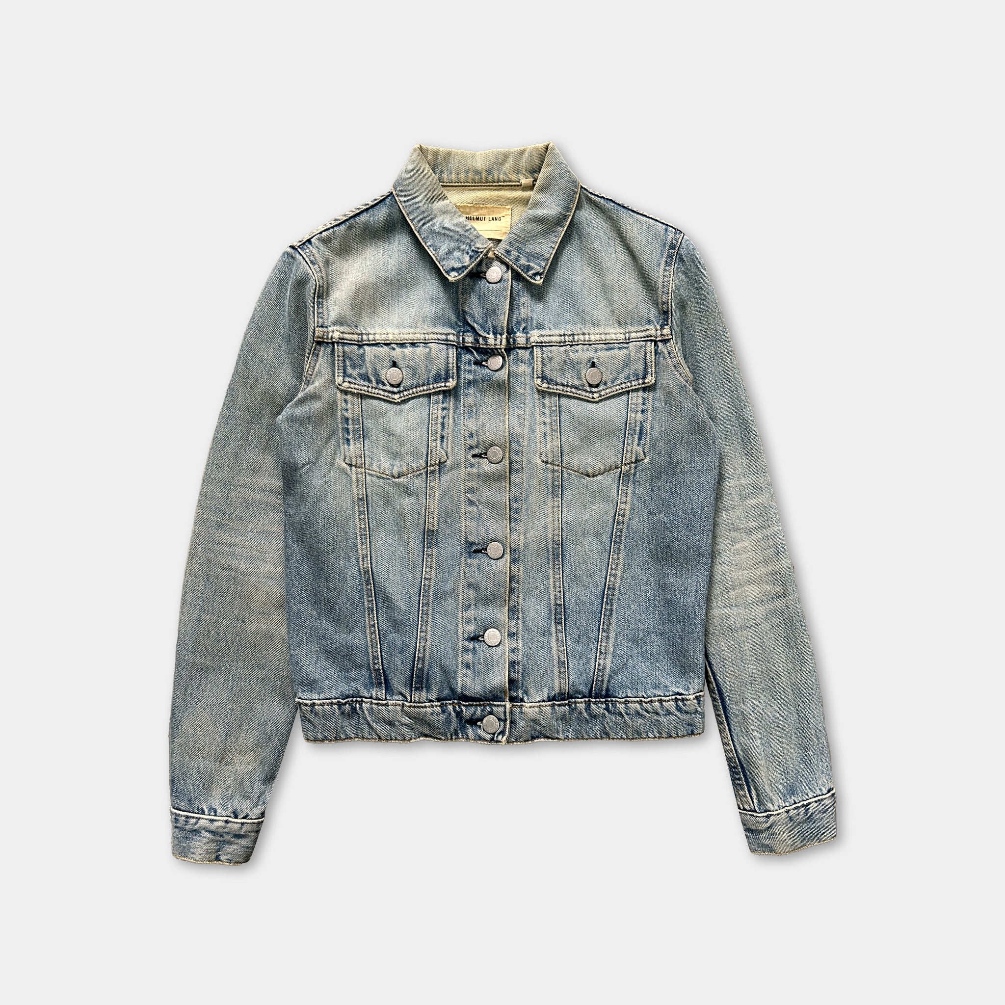 A denim jacket with a button-down front and long sleeves, displayed against a plain background.