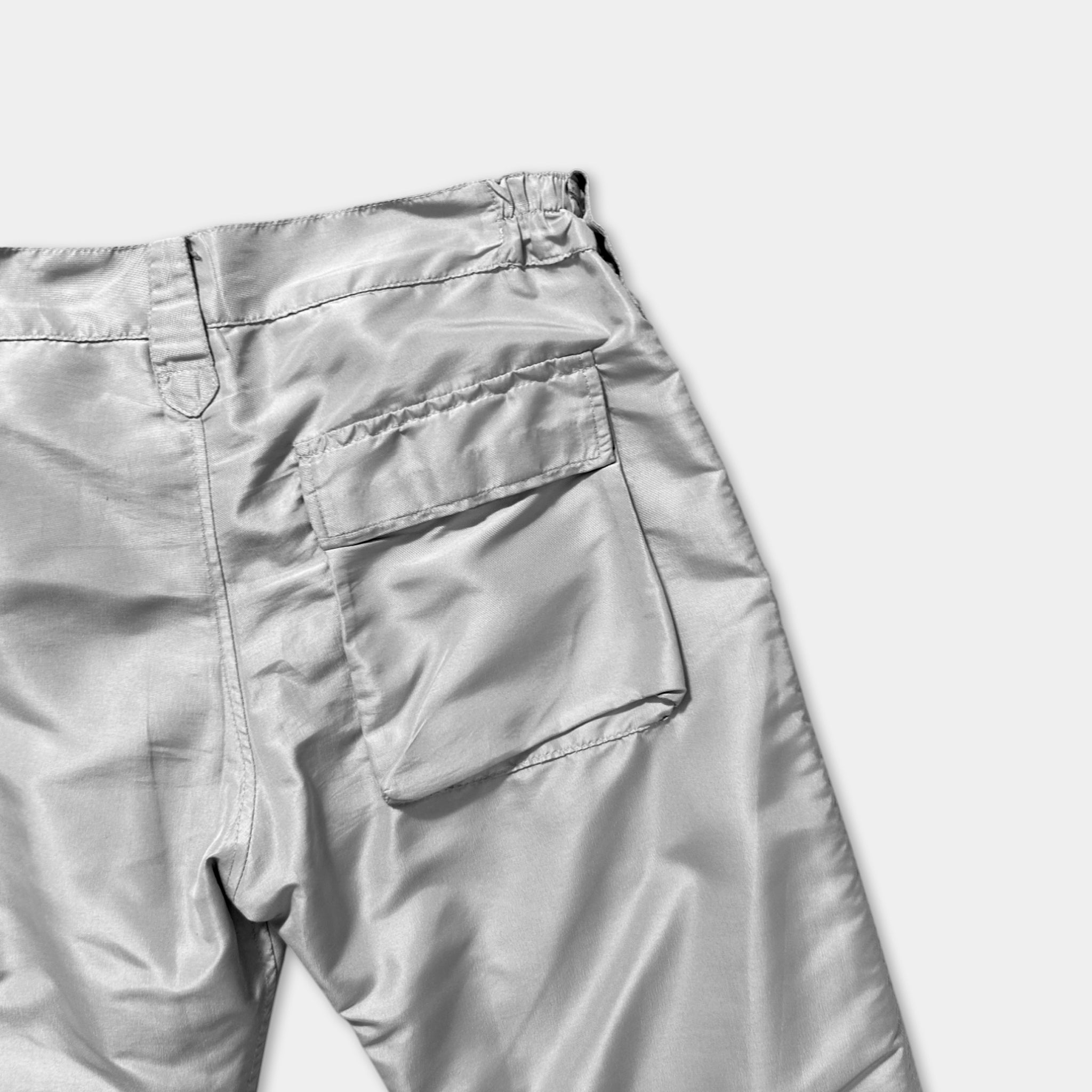 A pair of gray pants with a pocket on the front.