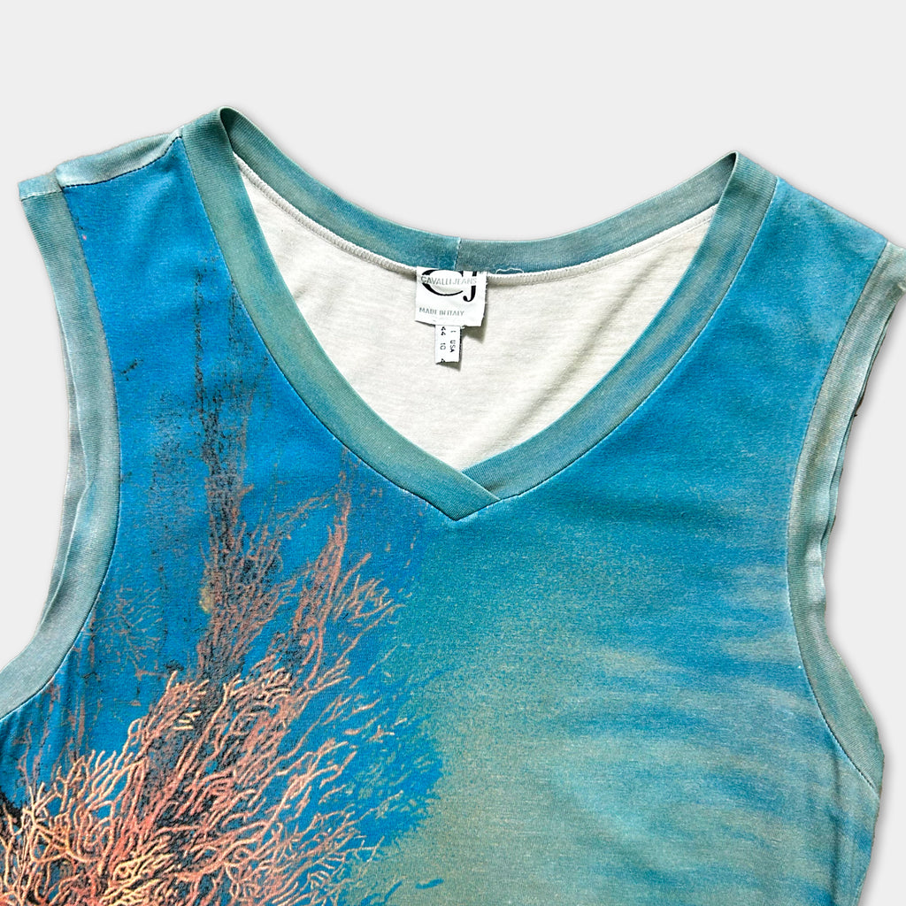 a sleeveless top with a blue and green color scheme, featuring a design of coral or seaweed on the front.