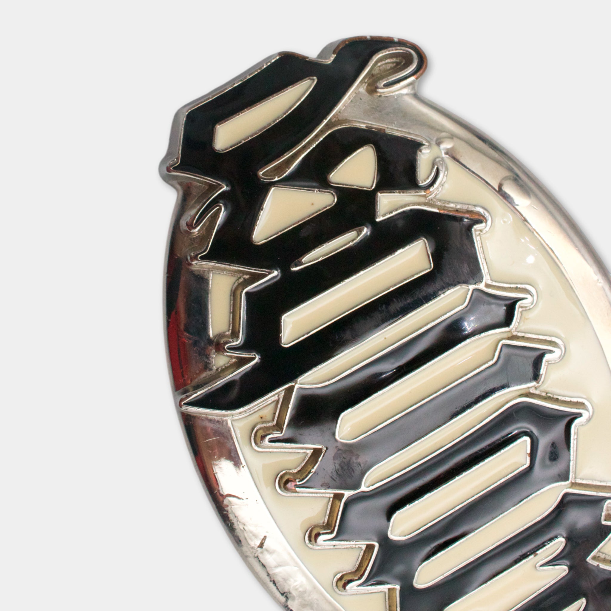 a close-up view of a decorative metal object with a black and white color scheme.