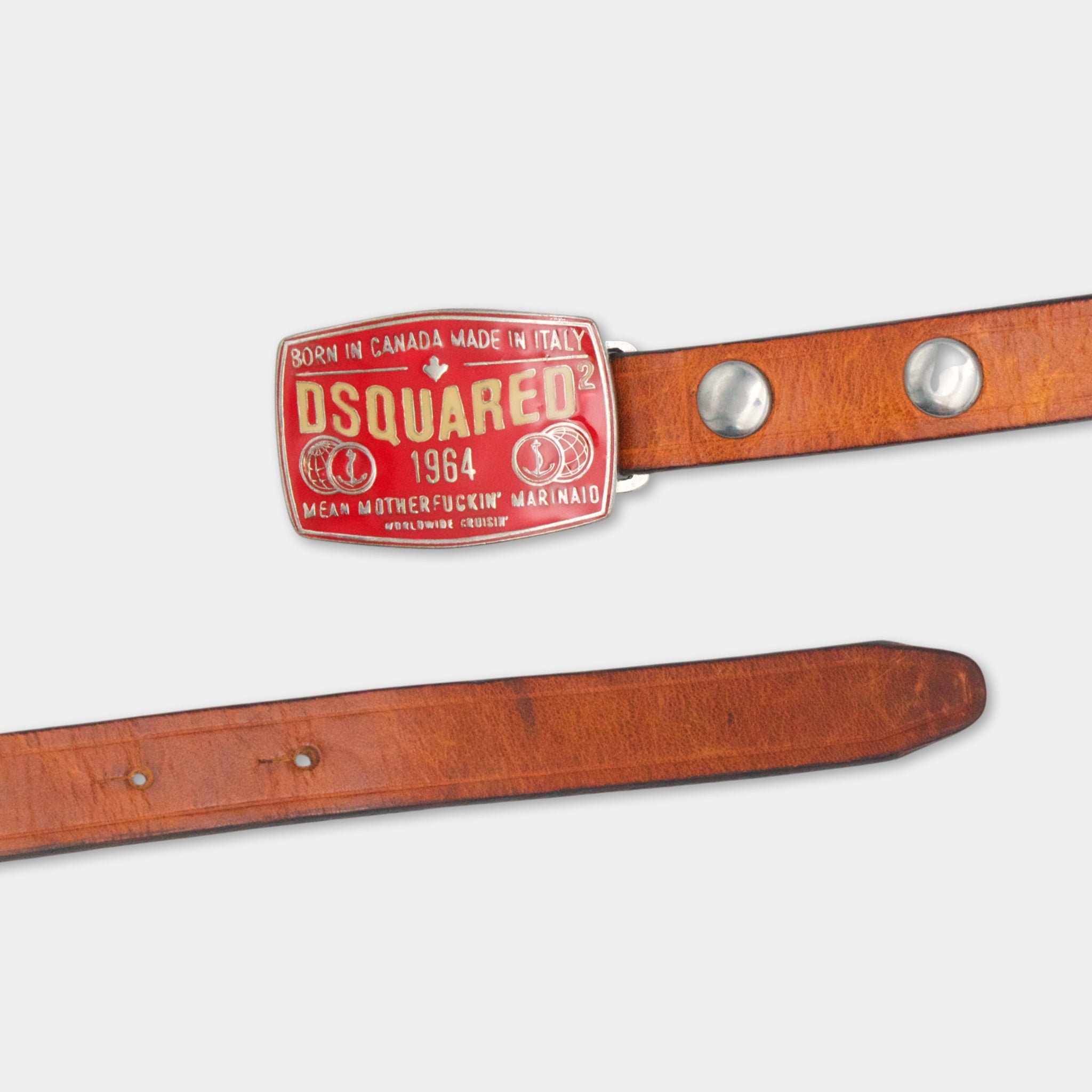 A brown leather belt with a red and gold D Square brand belt buckle.