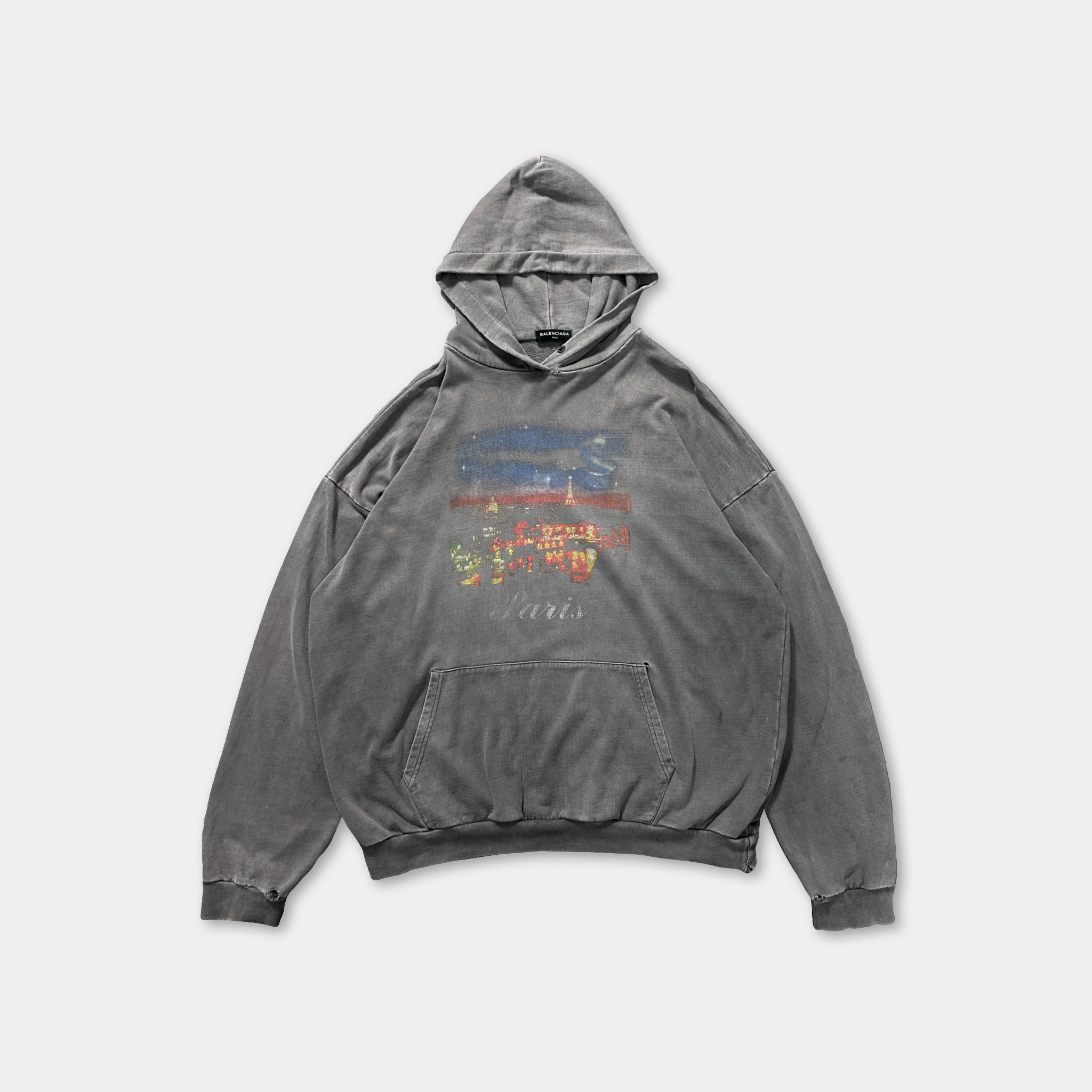 A gray hooded sweatshirt with a graphic design on the front.