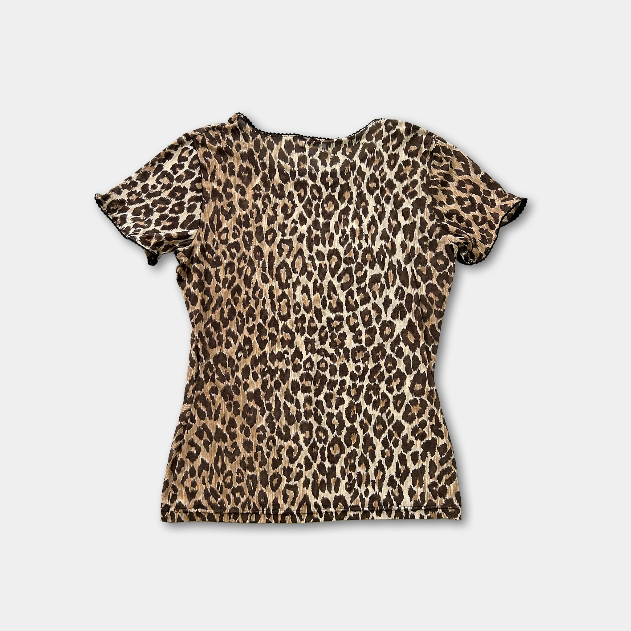 A leopard print top is displayed against a white background.