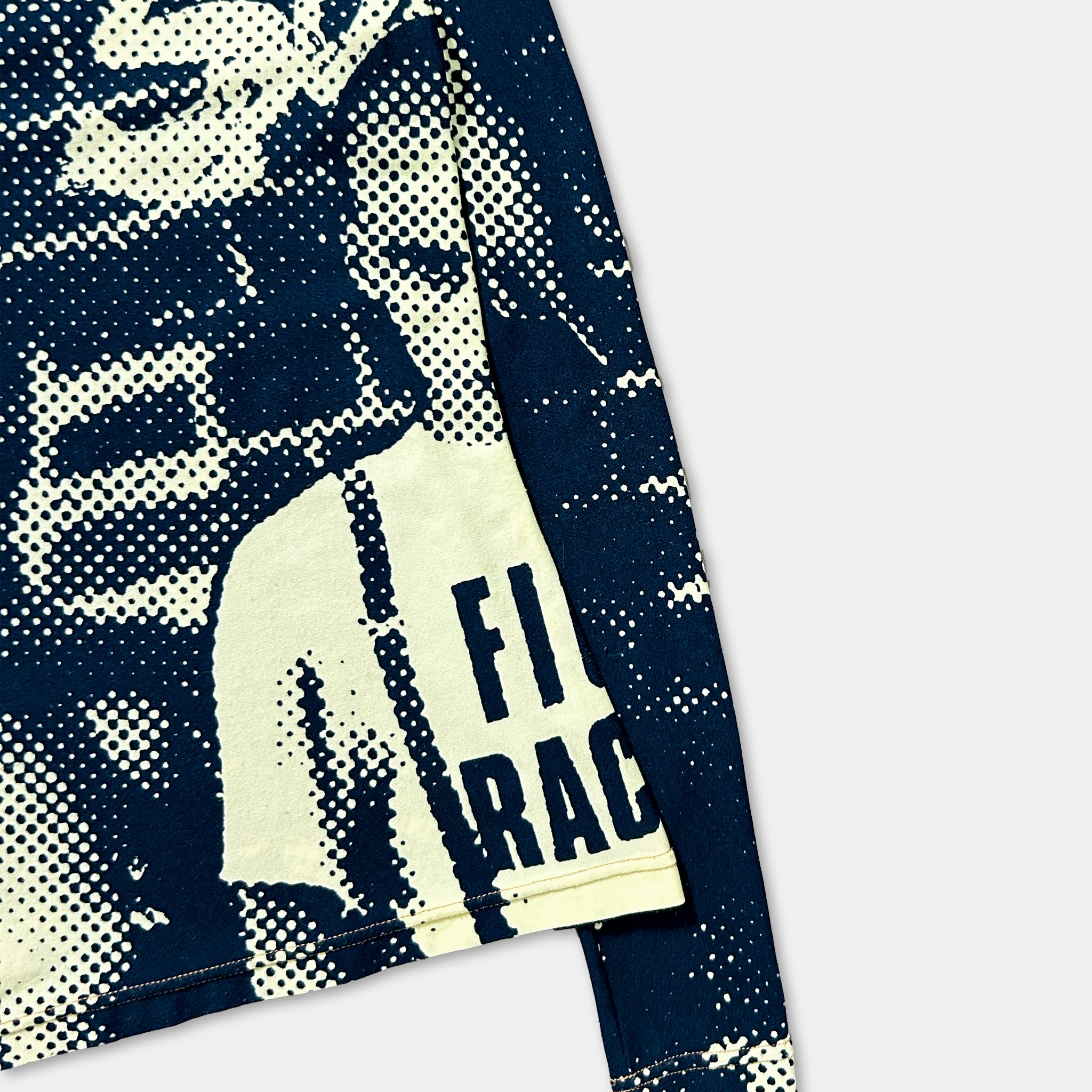 a close-up view of a long-sleeved shirt with a distinctive black and white pattern.