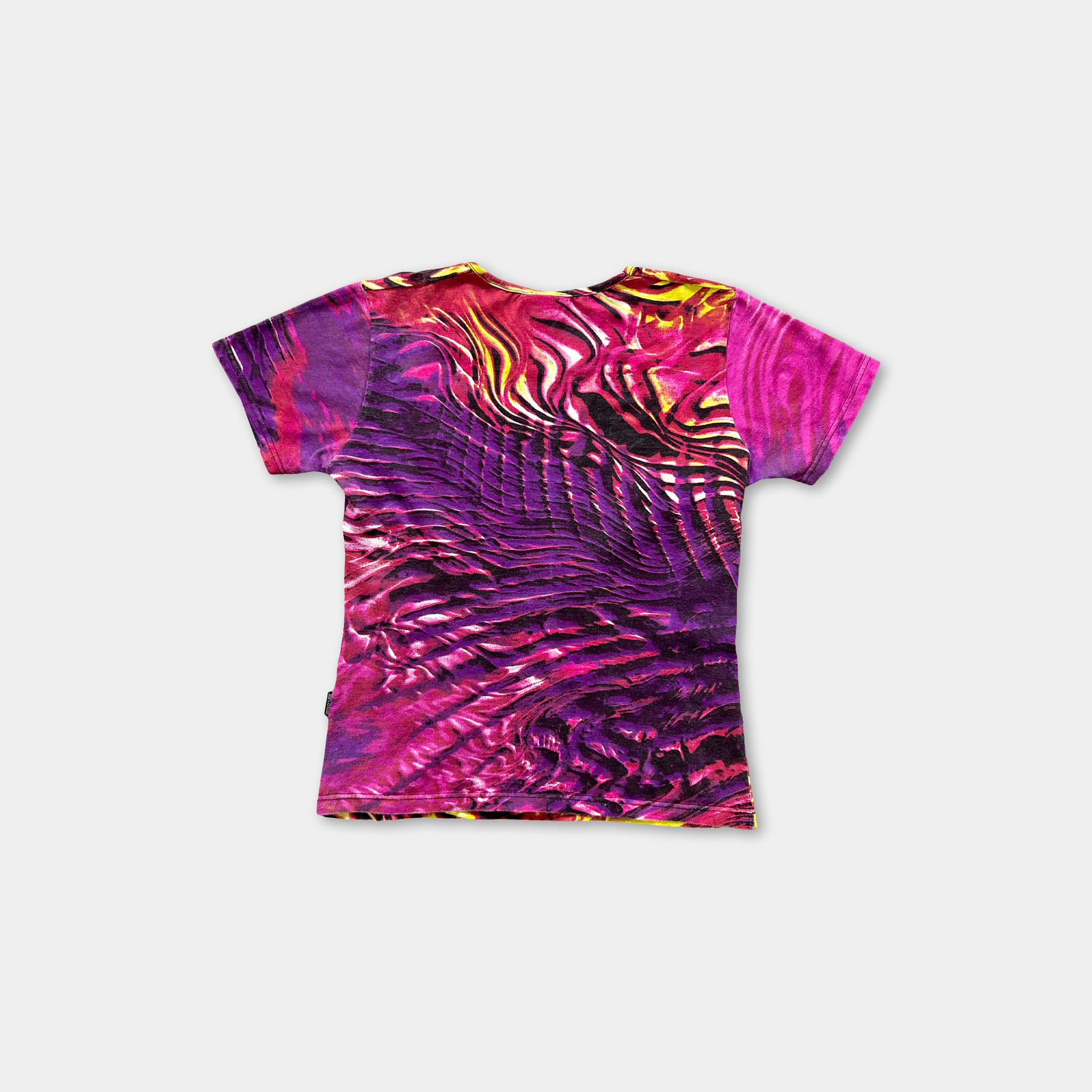a vibrant, colorful printed t-shirt with a striking abstract pattern in shades of pink, purple, and yellow.