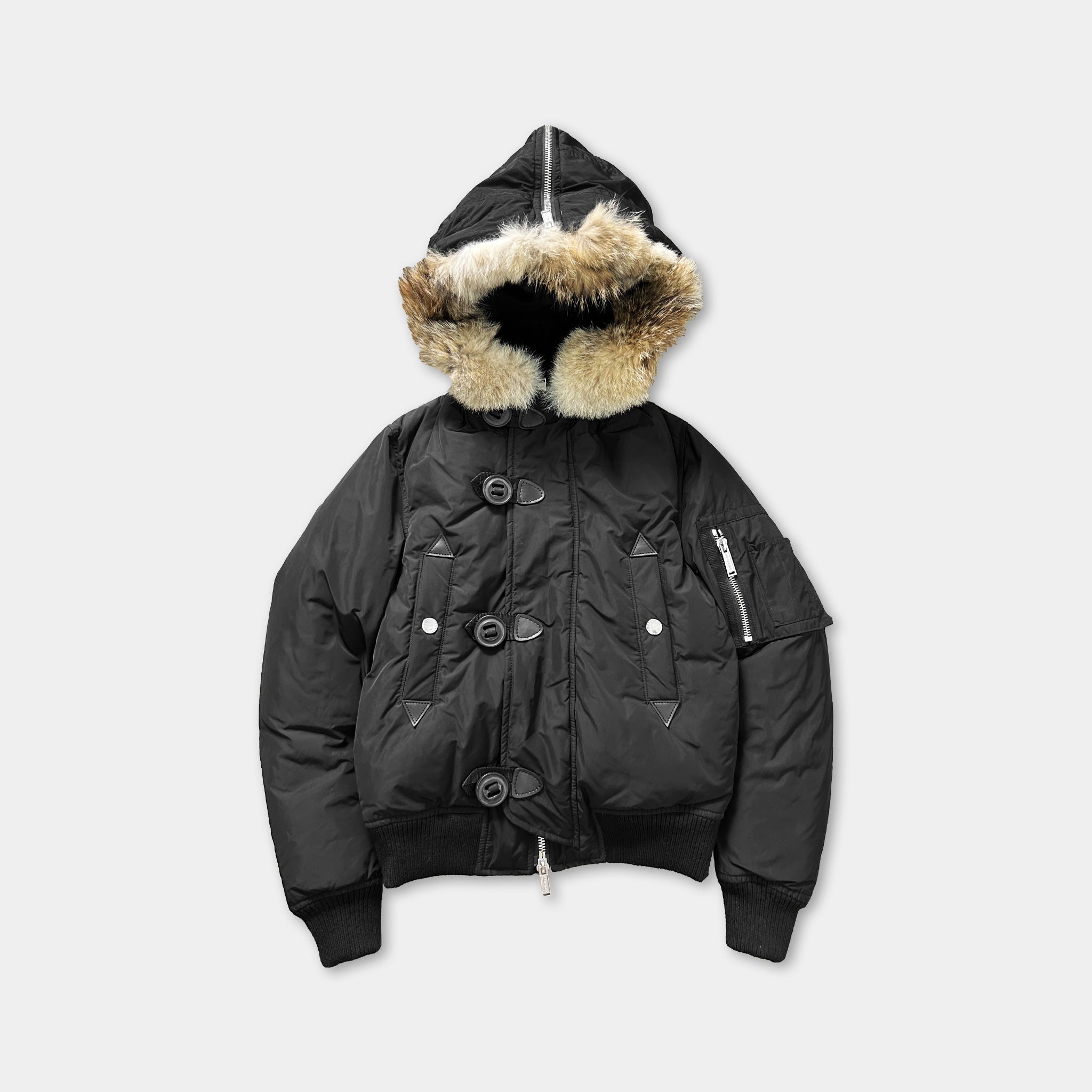 A black padded jacket with a fur-lined hood and buttons.