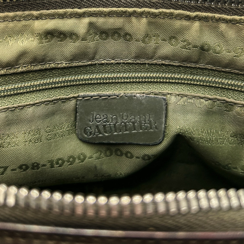 the interior of a bag, specifically the zipper and the label inside.