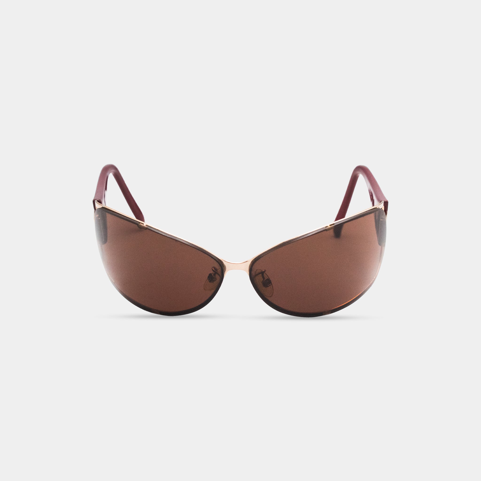 A pair of brown sunglasses with red frames.