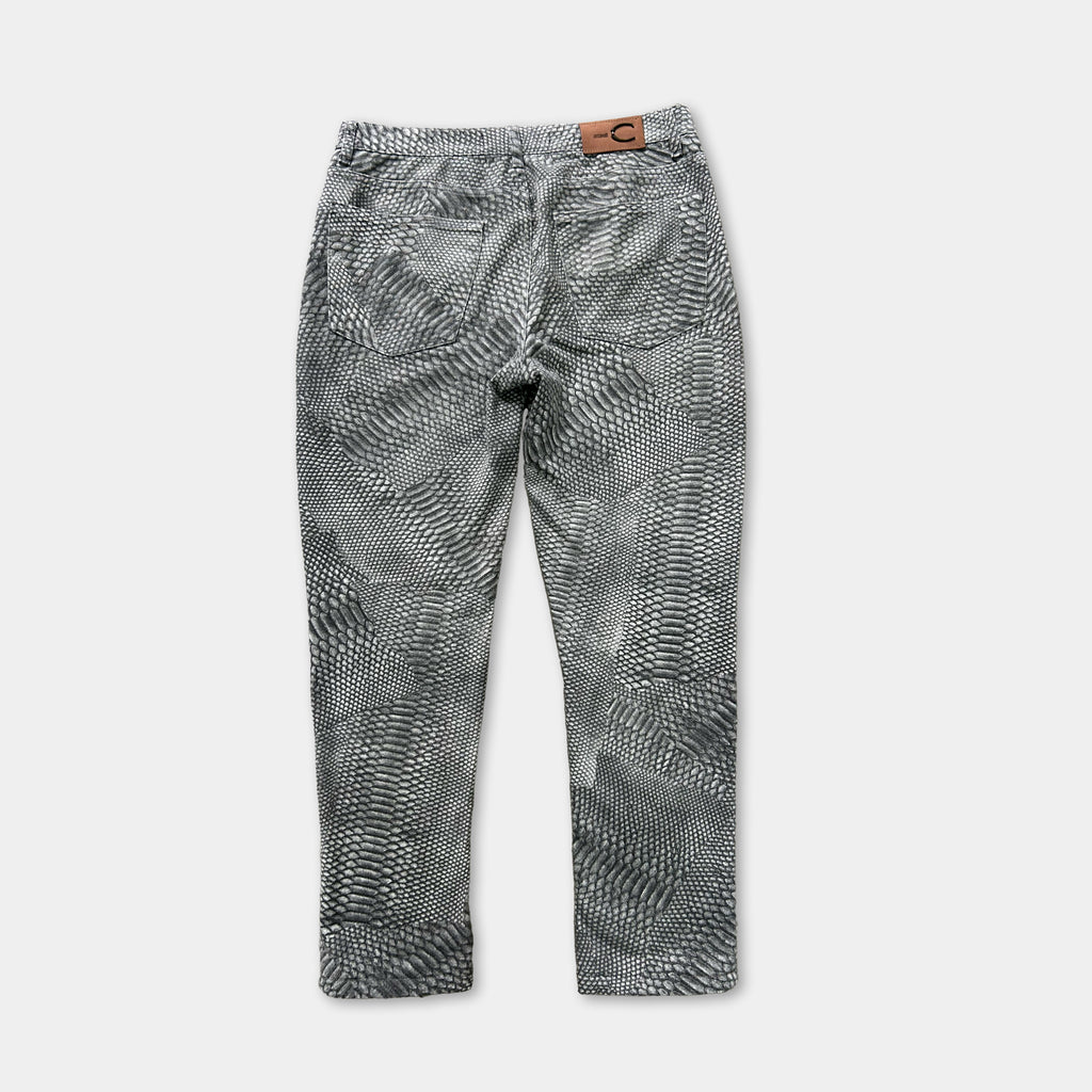 A pair of black and white patterned jeans with a distinctive geometric design.