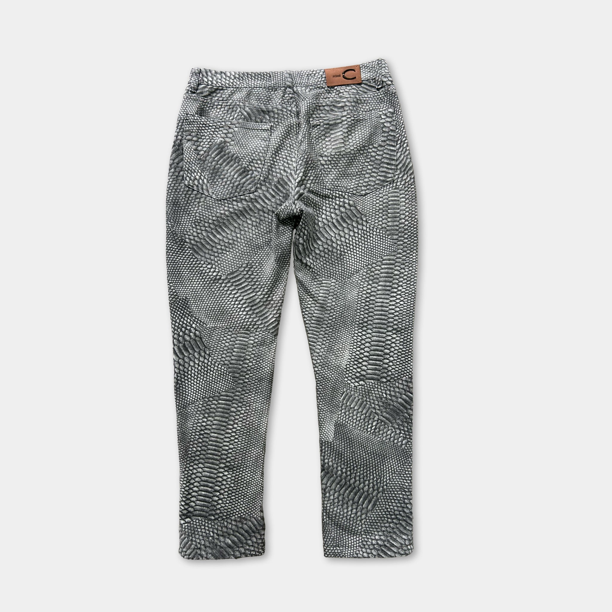 A pair of black and white patterned jeans with a distinctive geometric design.