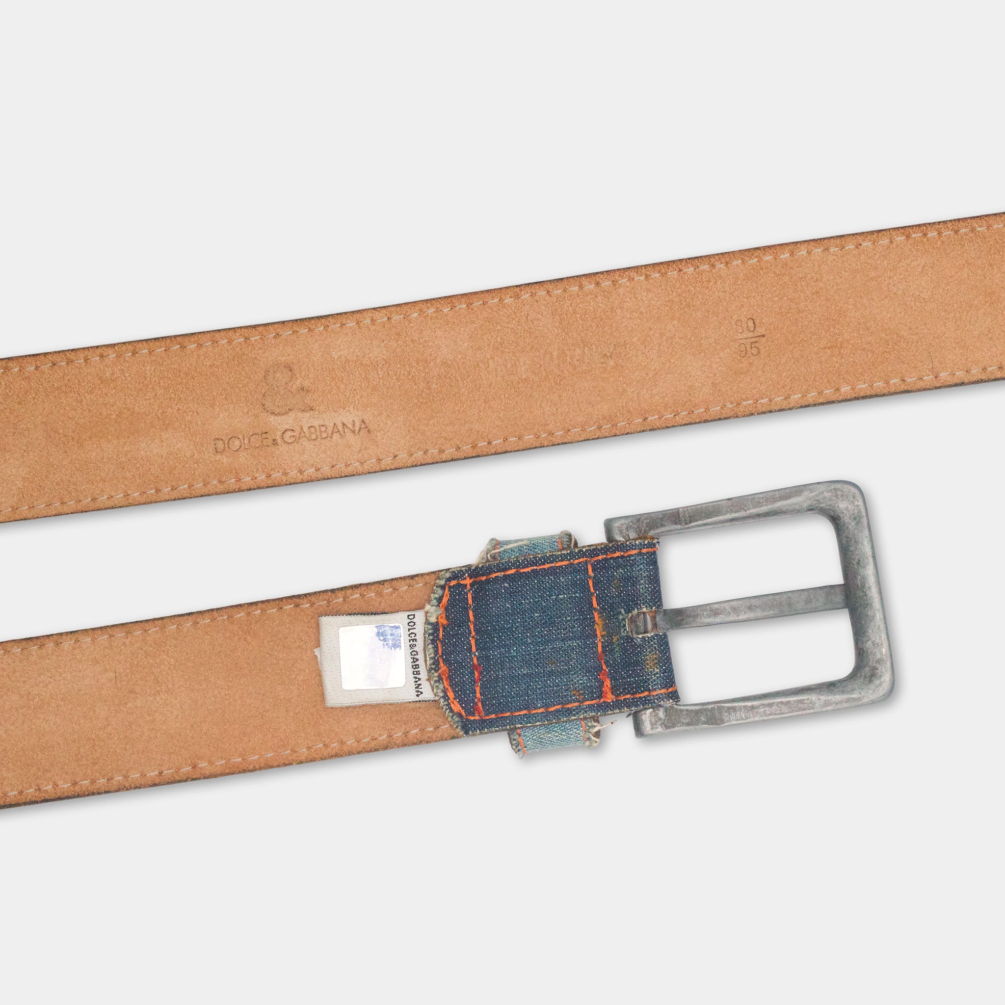 A brown leather belt with a metal buckle, featuring the brand name 'DOLCE GABBANA' printed on it.
